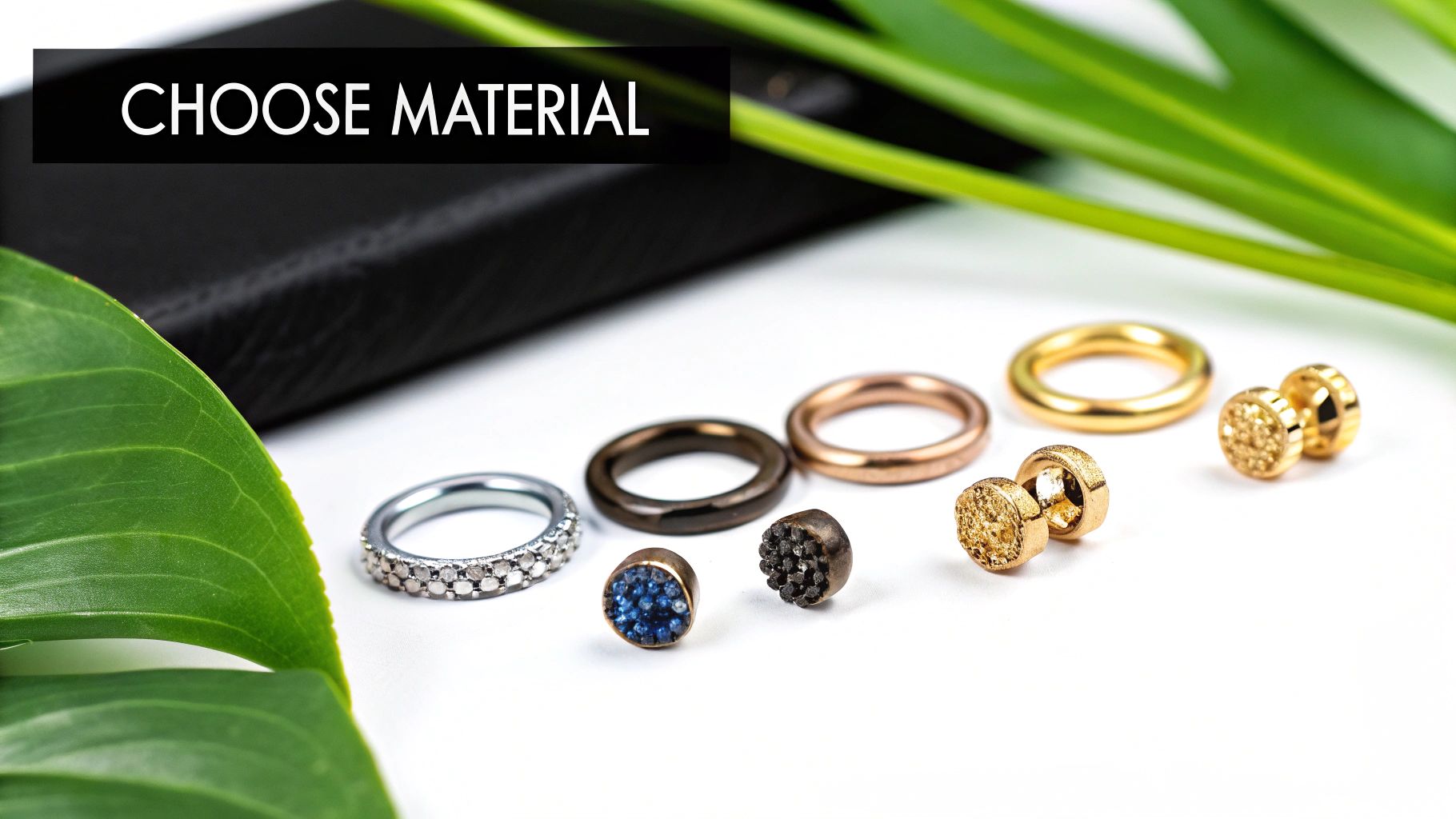 Various nose piercing jewelry materials including silver, rose gold, black, and gold rings and studs displayed