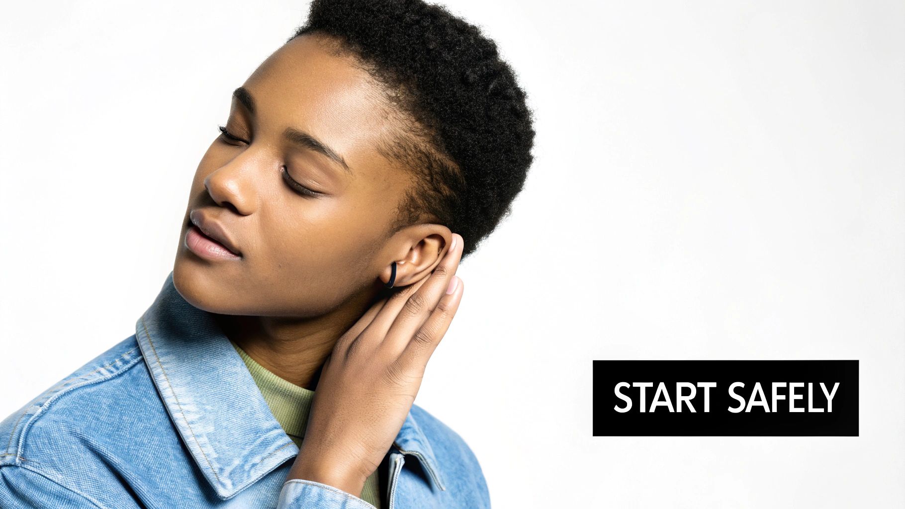 A person with beautifully stretched ears wearing stylish plugs.