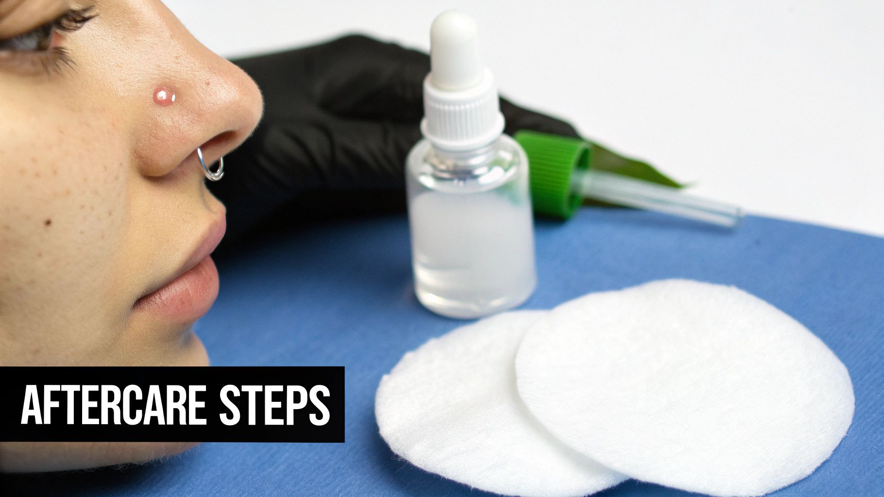Close-up of a person's nose with a stud, septum ring, and irritation, alongside aftercare products.