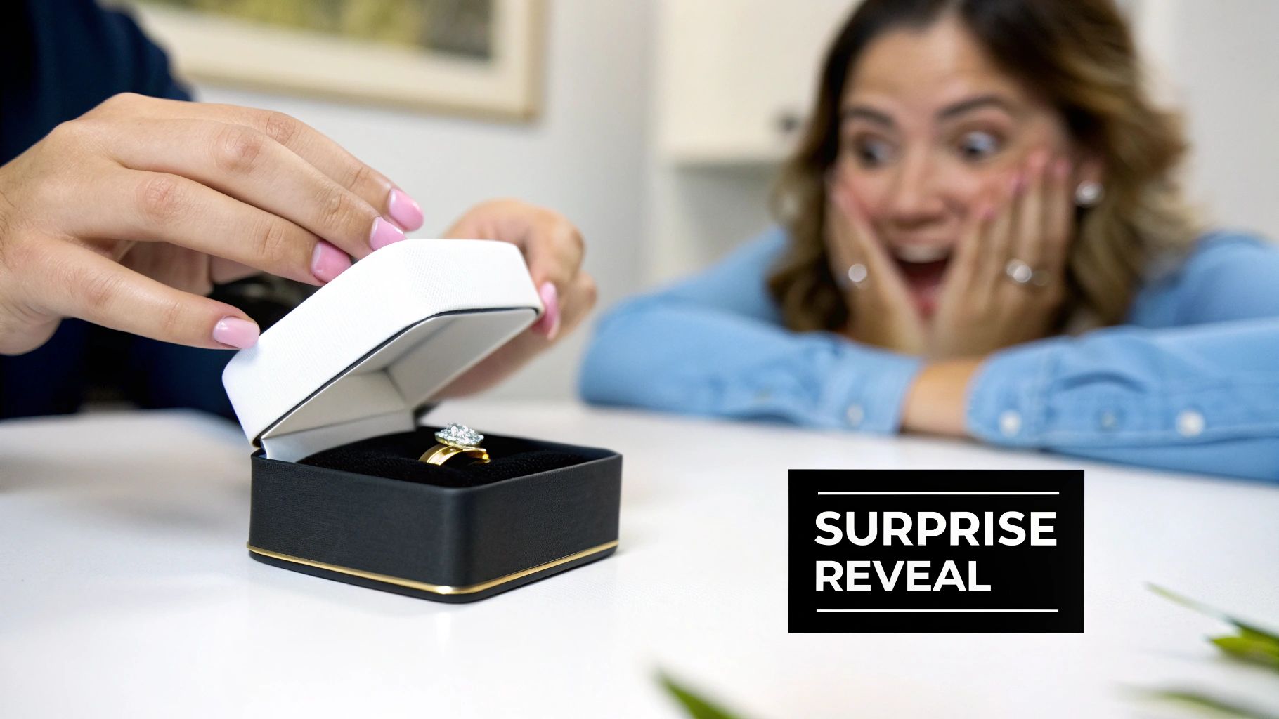 Hands open a ring box revealing a sparkling diamond ring, as a woman gasps in surprised delight.