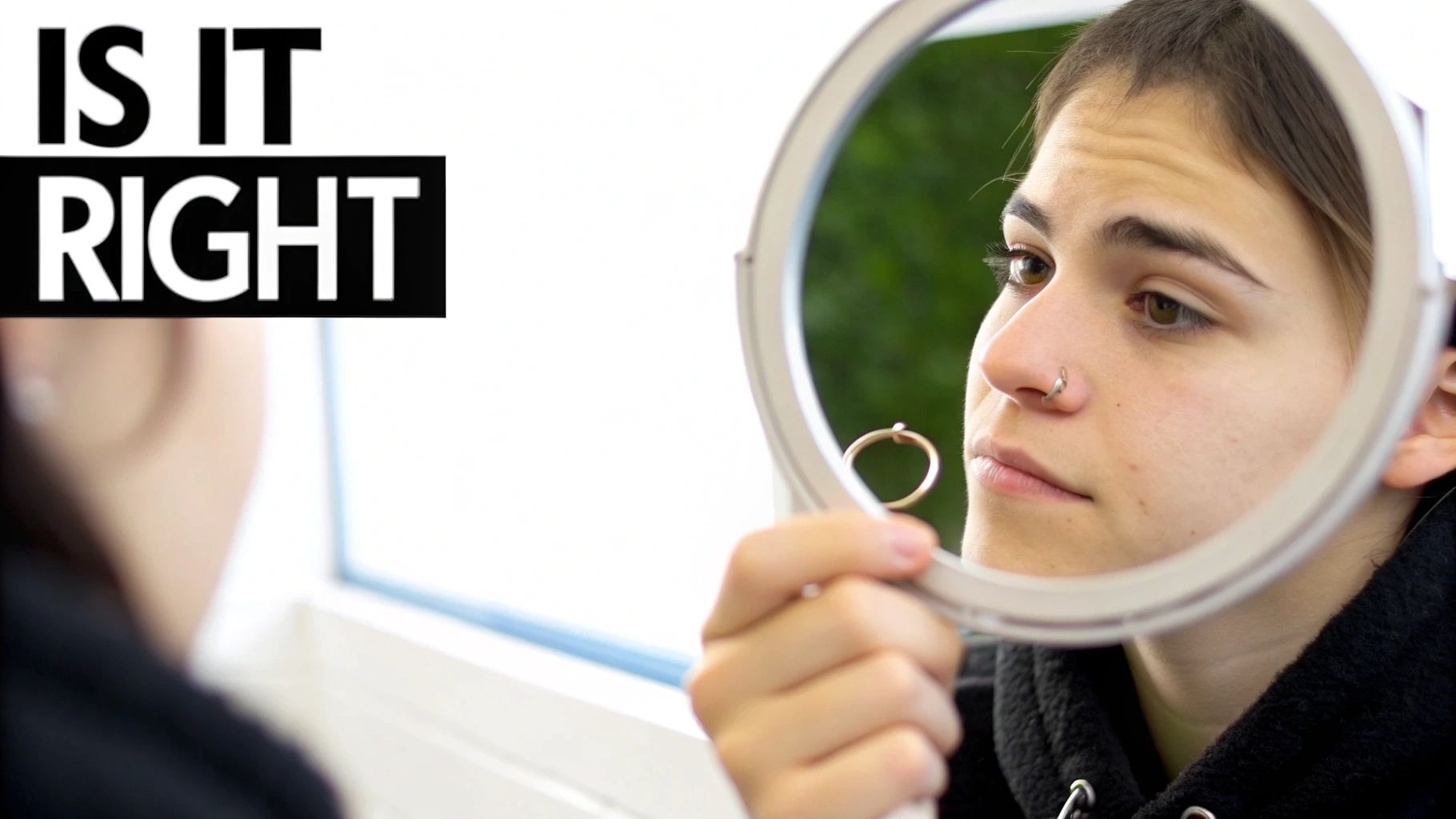 A person with a stylish septum piercing looking confidently at the camera.