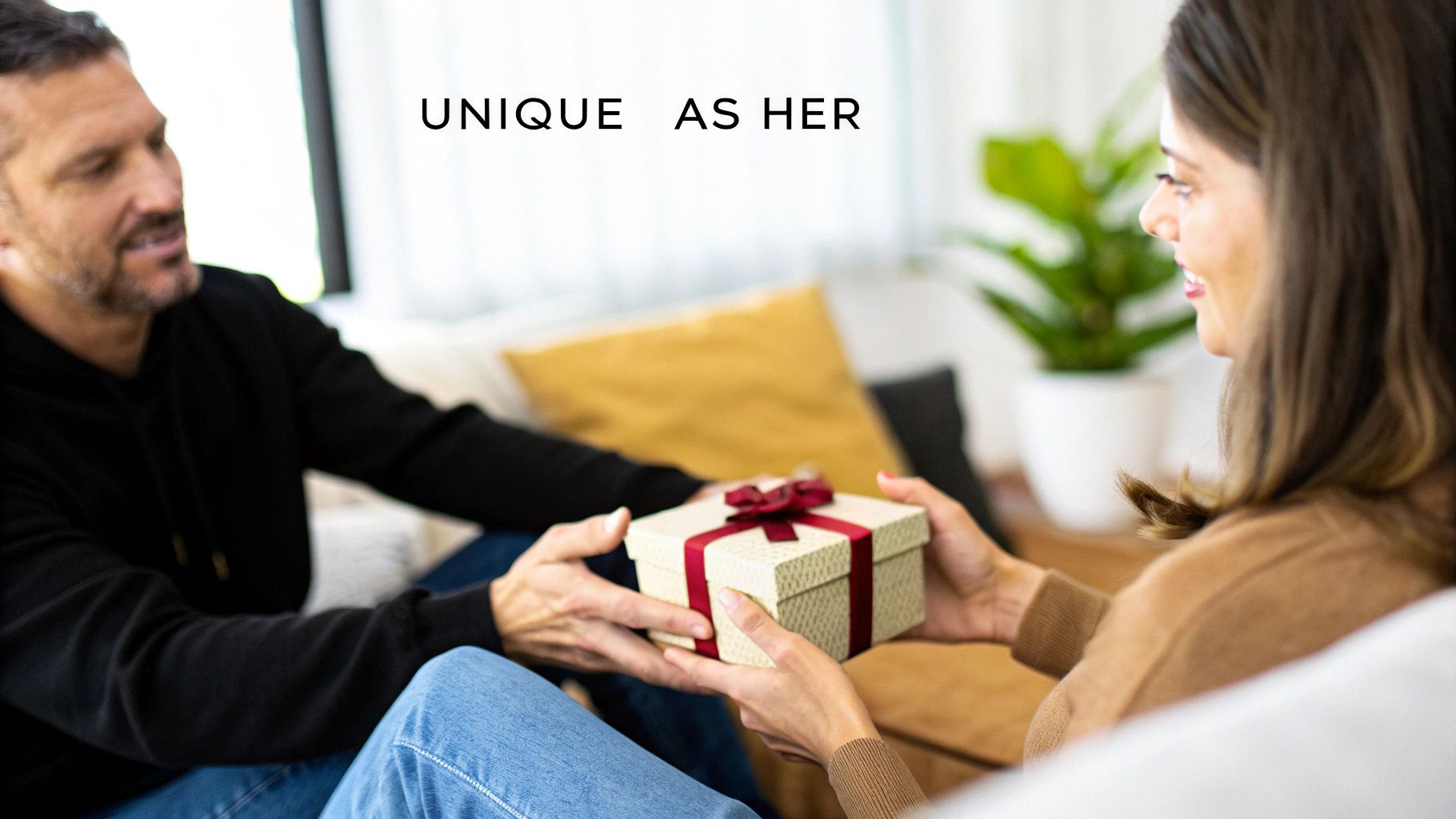 Close-up of a woman's hands holding a beautifully wrapped anniversary gift.