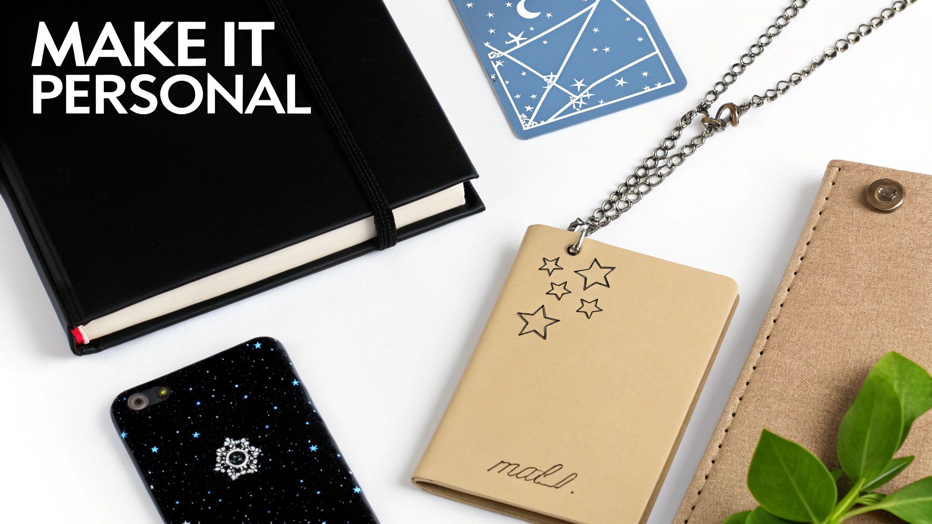 A collection of personalized items, including notebooks, a smartphone, and accessories, laid out on a white surface.