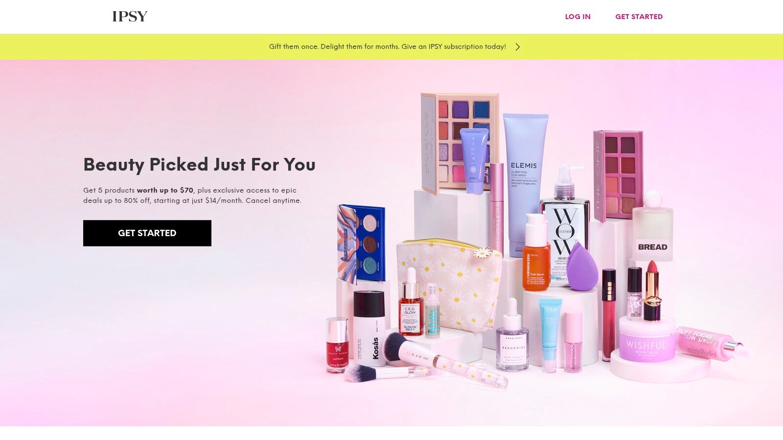 An Ipsy subscription bag shown with several beauty products including mascara, serums, and lip gloss