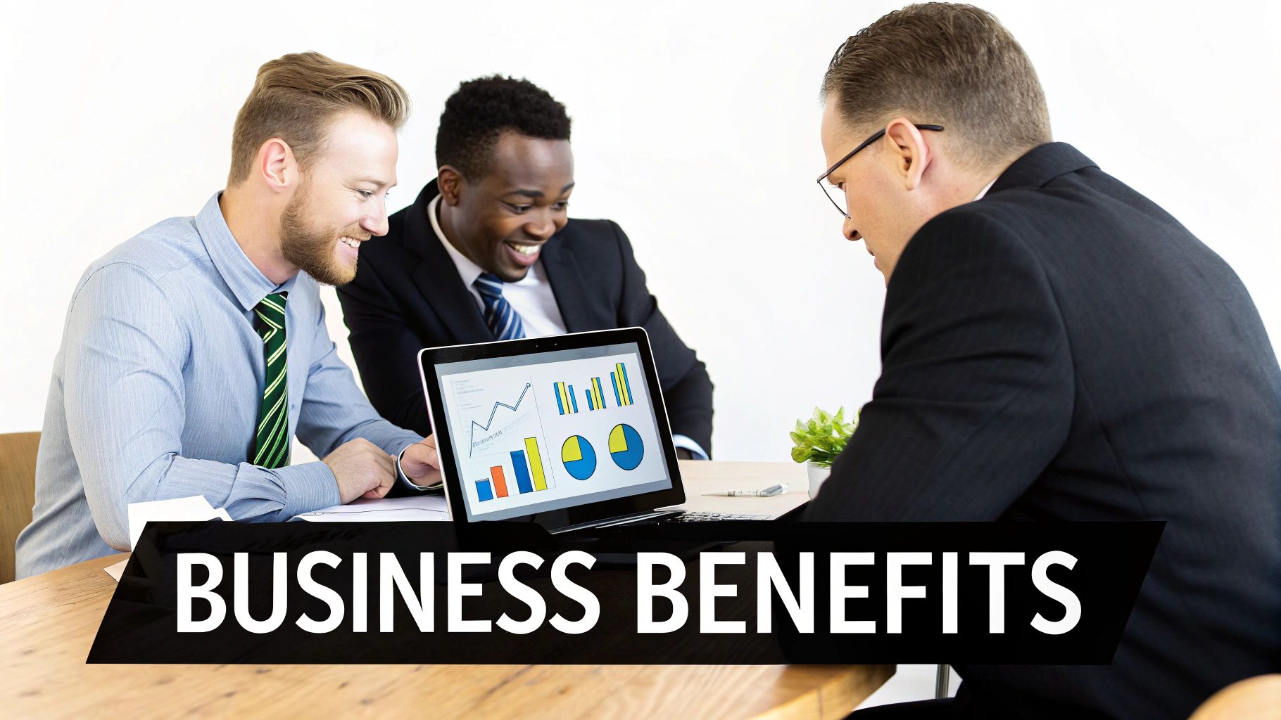 Three diverse businessmen smile while collaboratively analyzing financial charts on a laptop, discussing business benefits.