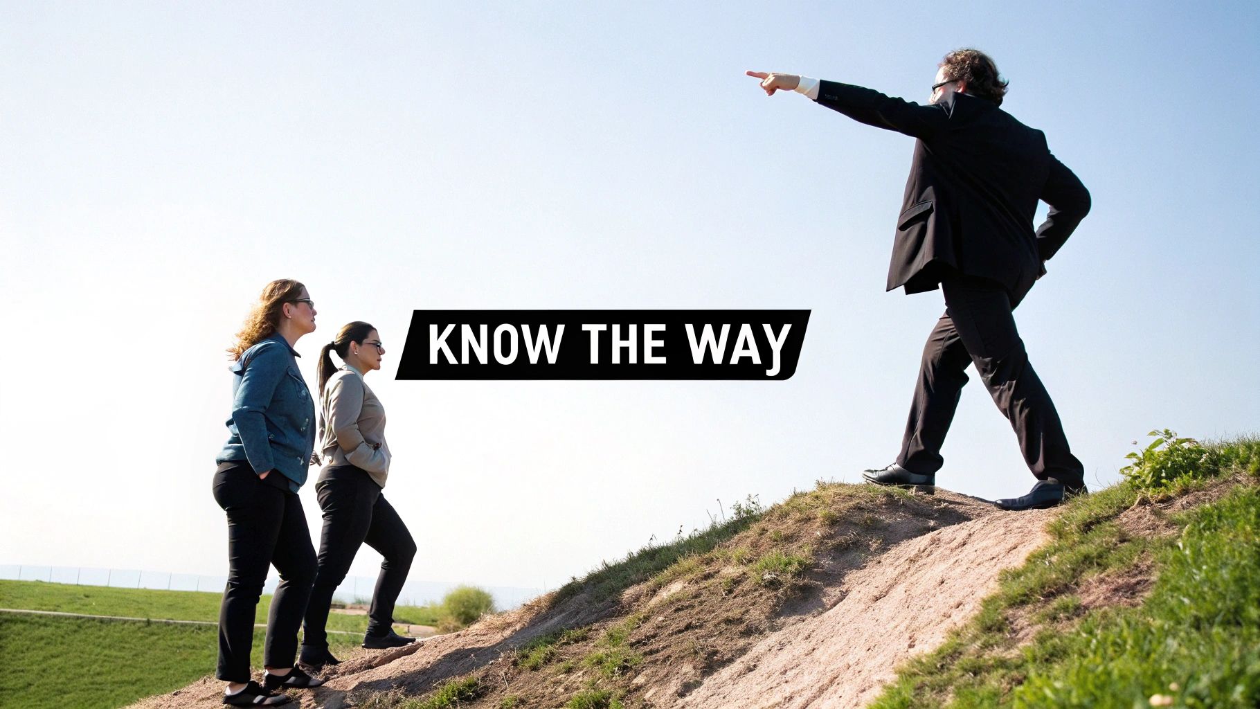 A man in a suit points the direction up a hill, followed by two women, with 'KNOW THE WAY' text.