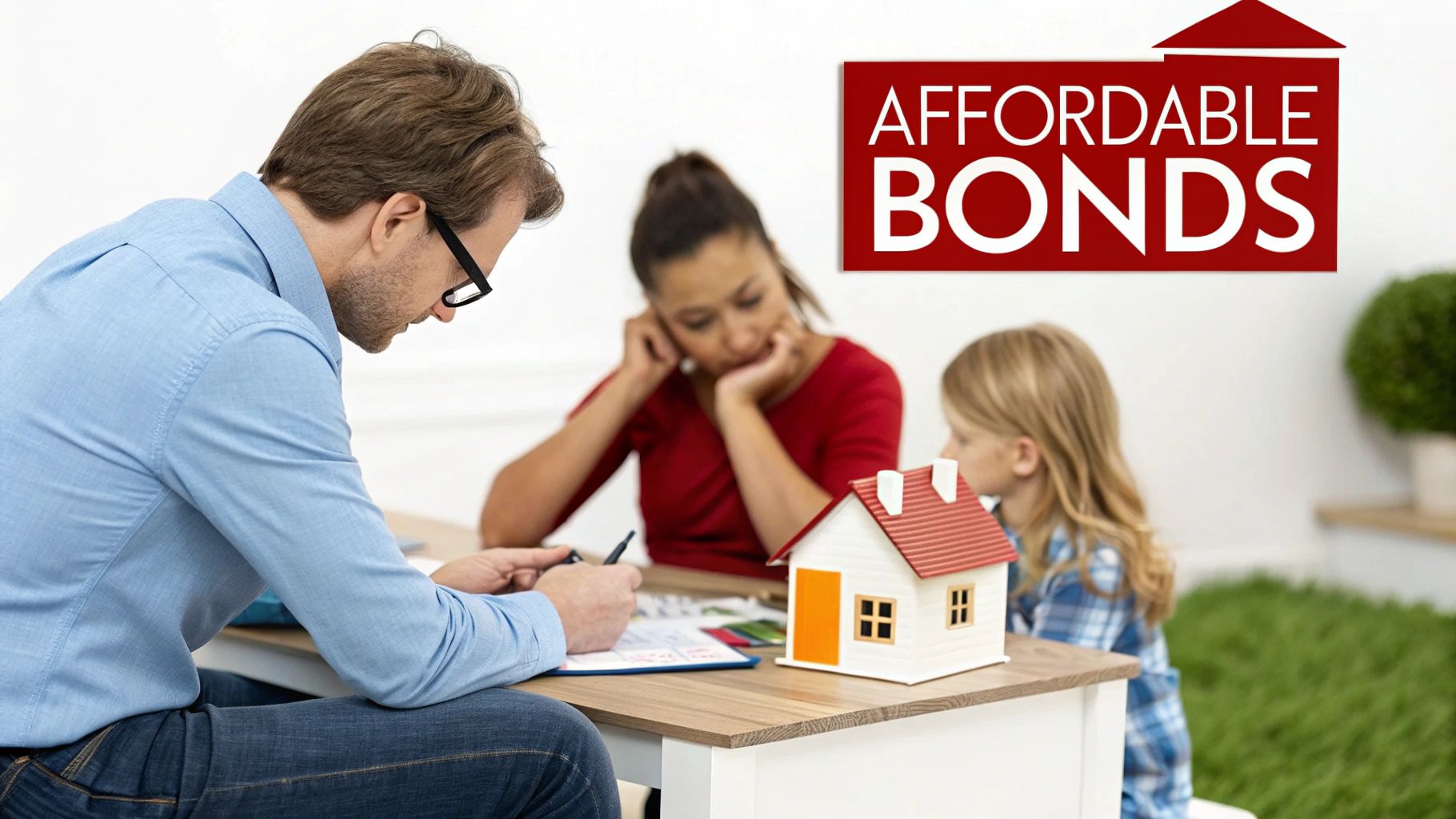 A man helps a woman and child with financial documents, with a model house on the table.