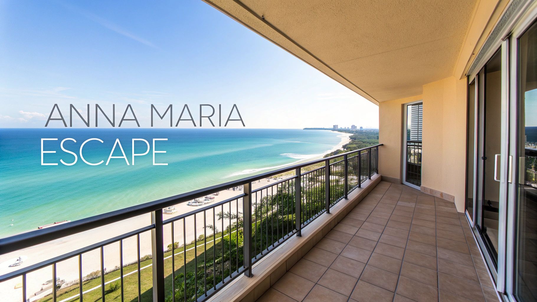 A spacious balcony offers a stunning panoramic view of a sandy beach, turquoise ocean, and distant coastline.