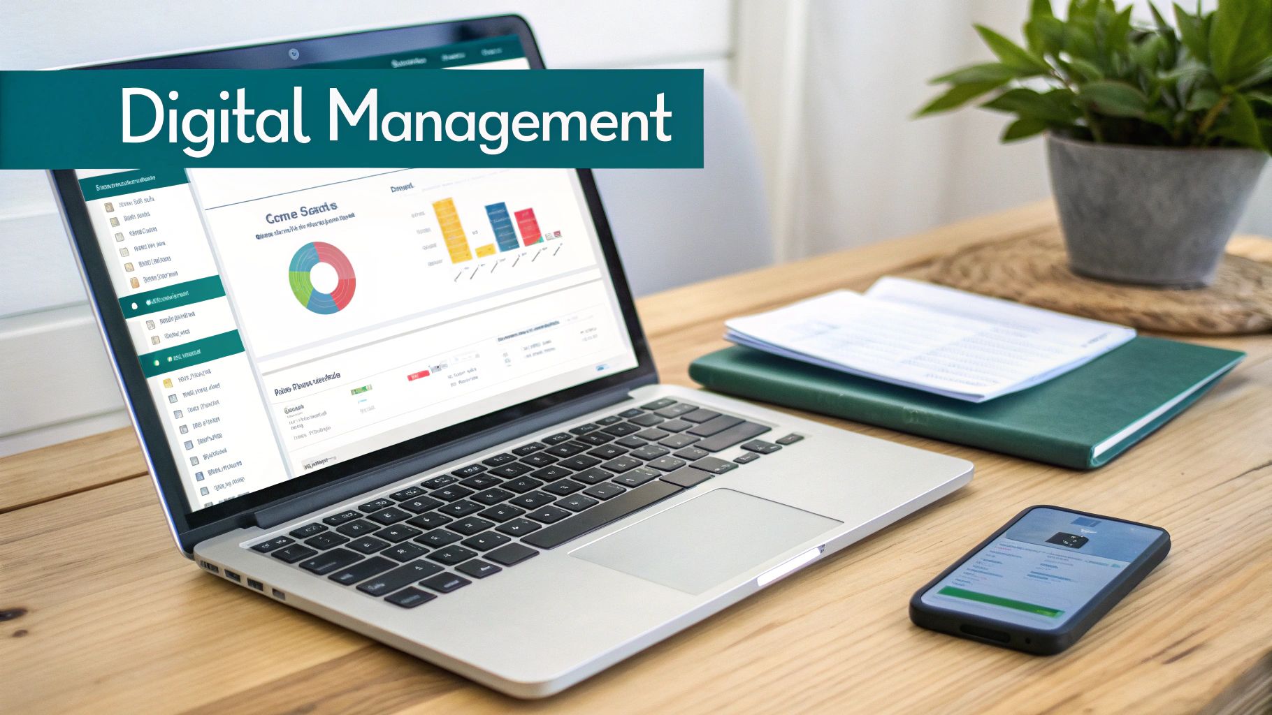 A laptop displaying data charts, a smartphone, and a notebook on a wooden desk, indicating digital management.