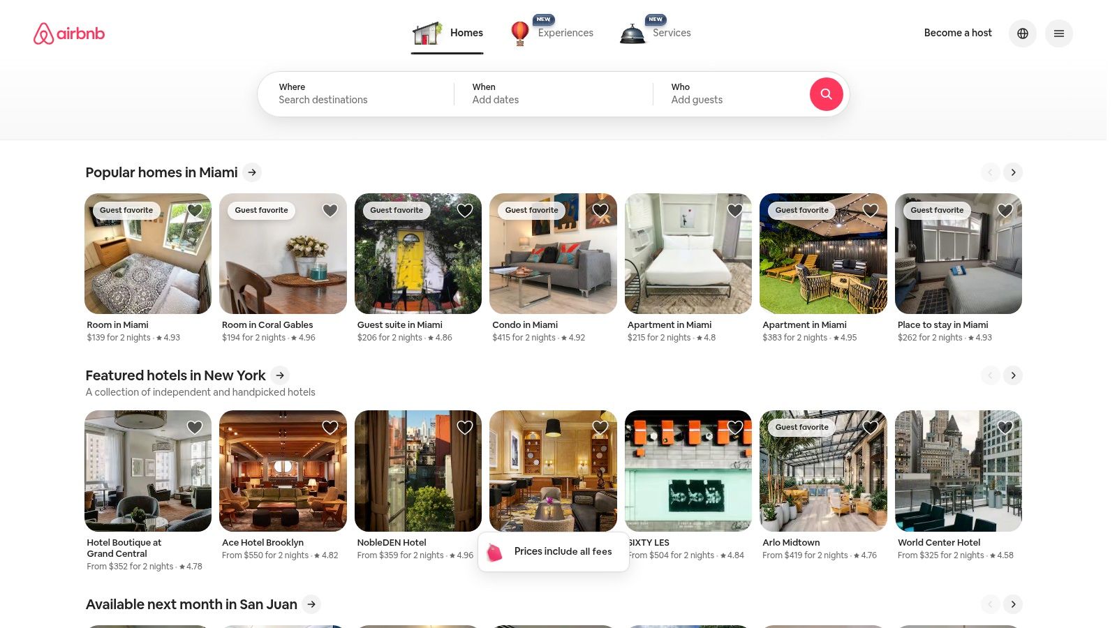 A person using a laptop to browse vacation rental listings on the Airbnb website.
