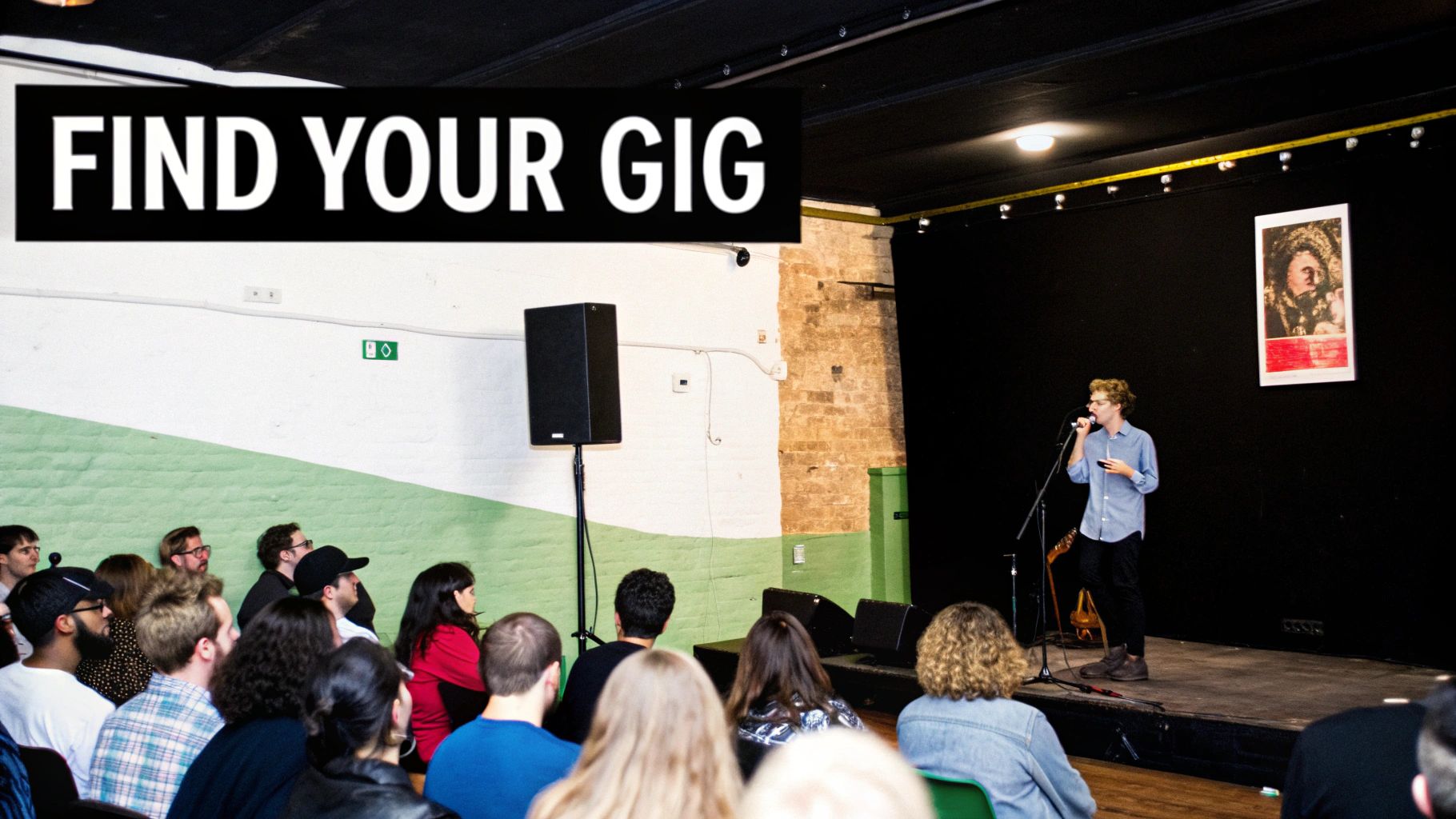 A performer on stage speaking into a microphone for an audience at a live music or open mic event.