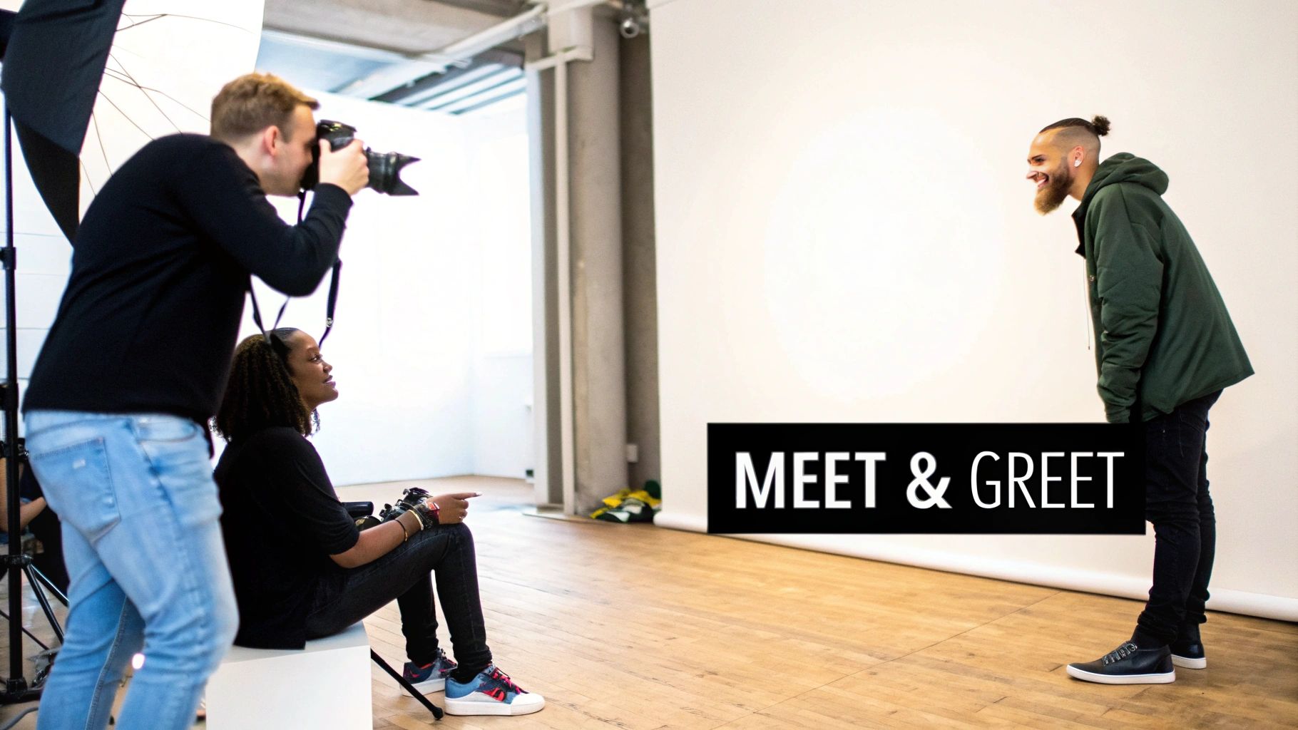 A photographer captures a woman during a studio session while a man smiles at a 'Meet & Greet' event.