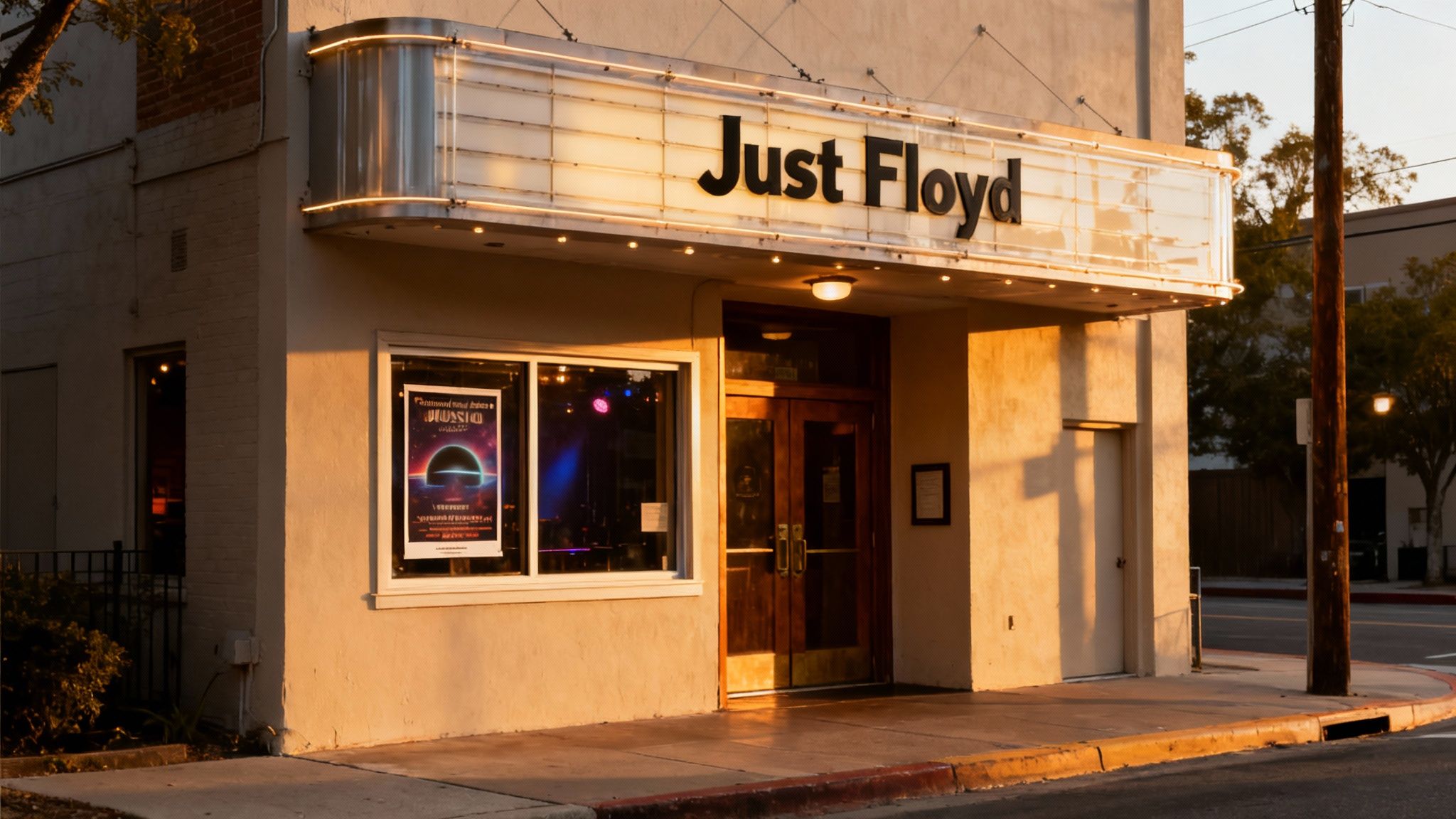 Exterior of a building with a brightly lit marquee sign displaying 'Just Floyd' at dusk.