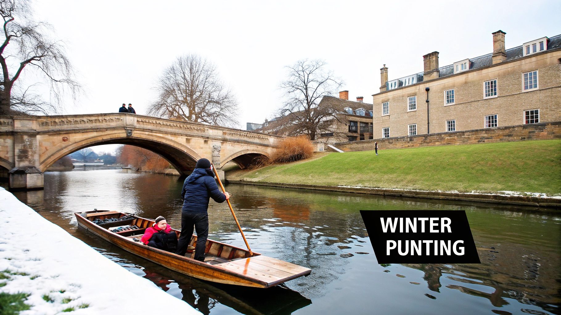 Punting on River Cam in Cambridge during winter with stone bridge and historic college buildings