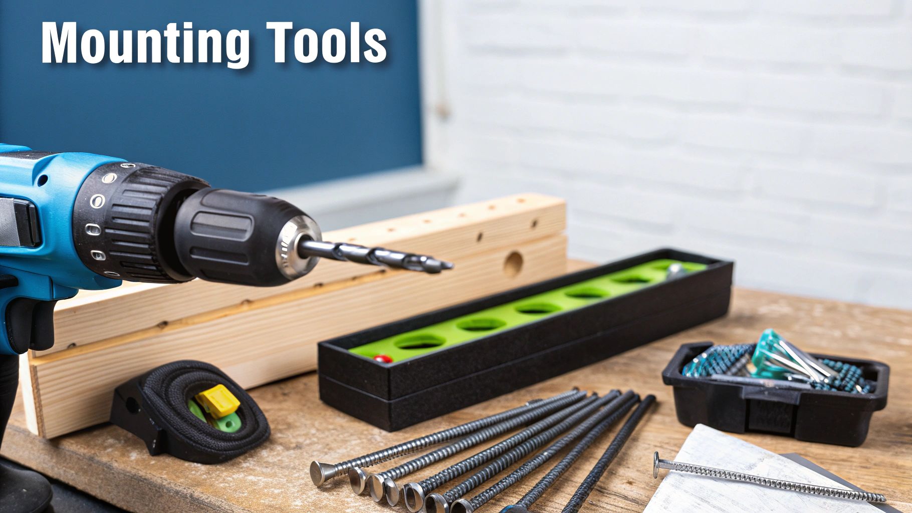 A TV wall mount being installed on a wall with tools nearby.