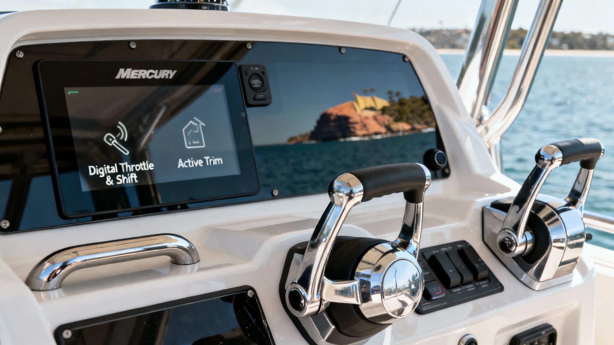 A modern Mercury outboard motor's digital display and throttle system.