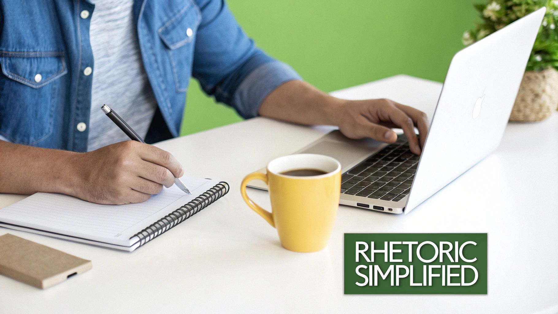 Close-up of a person writing in a notebook while typing on a laptop, with a coffee mug.