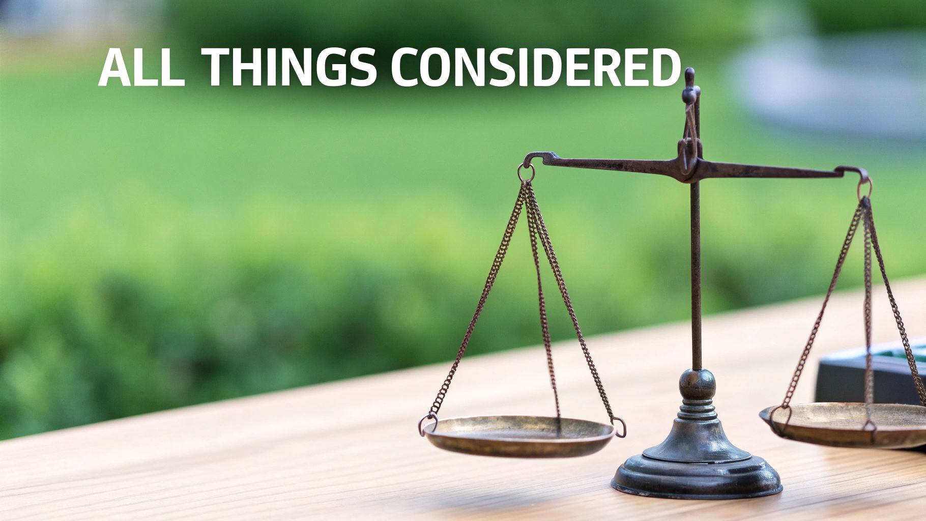 A brass justice scale on a wooden table with 'ALL THINGS CONSIDERED' text, green background.