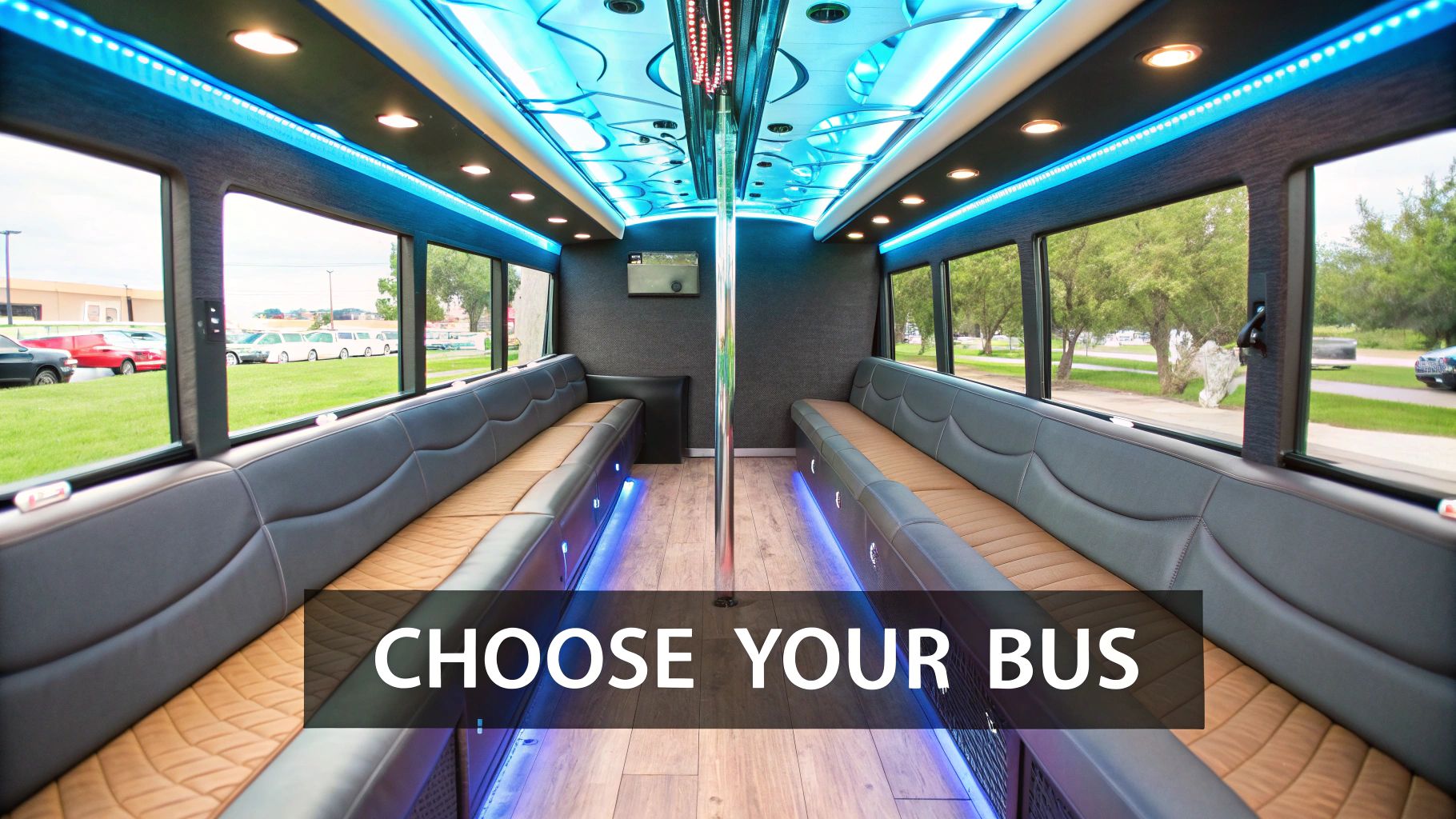 Luxurious party bus interior with blue LED lighting, comfortable seating, large windows, and a dance pole.