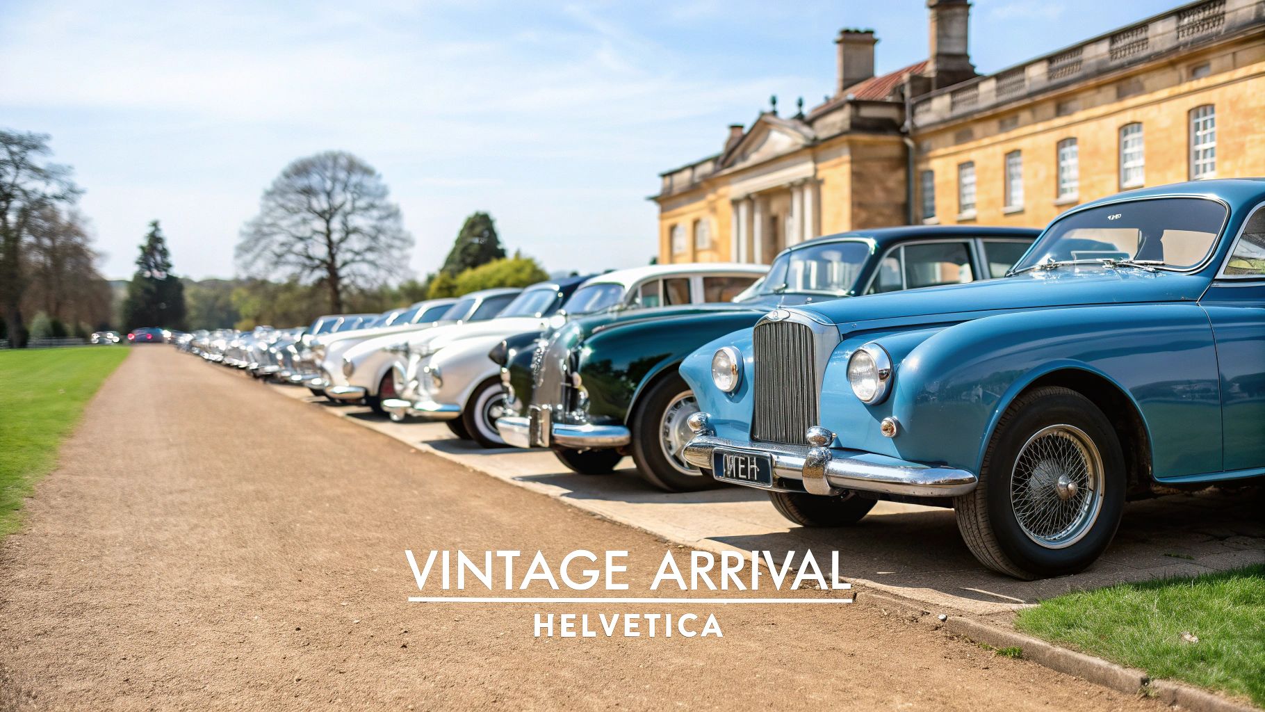 A long line of vintage cars, including blue, green, and white models, parked on a gravel path near a grand estate.