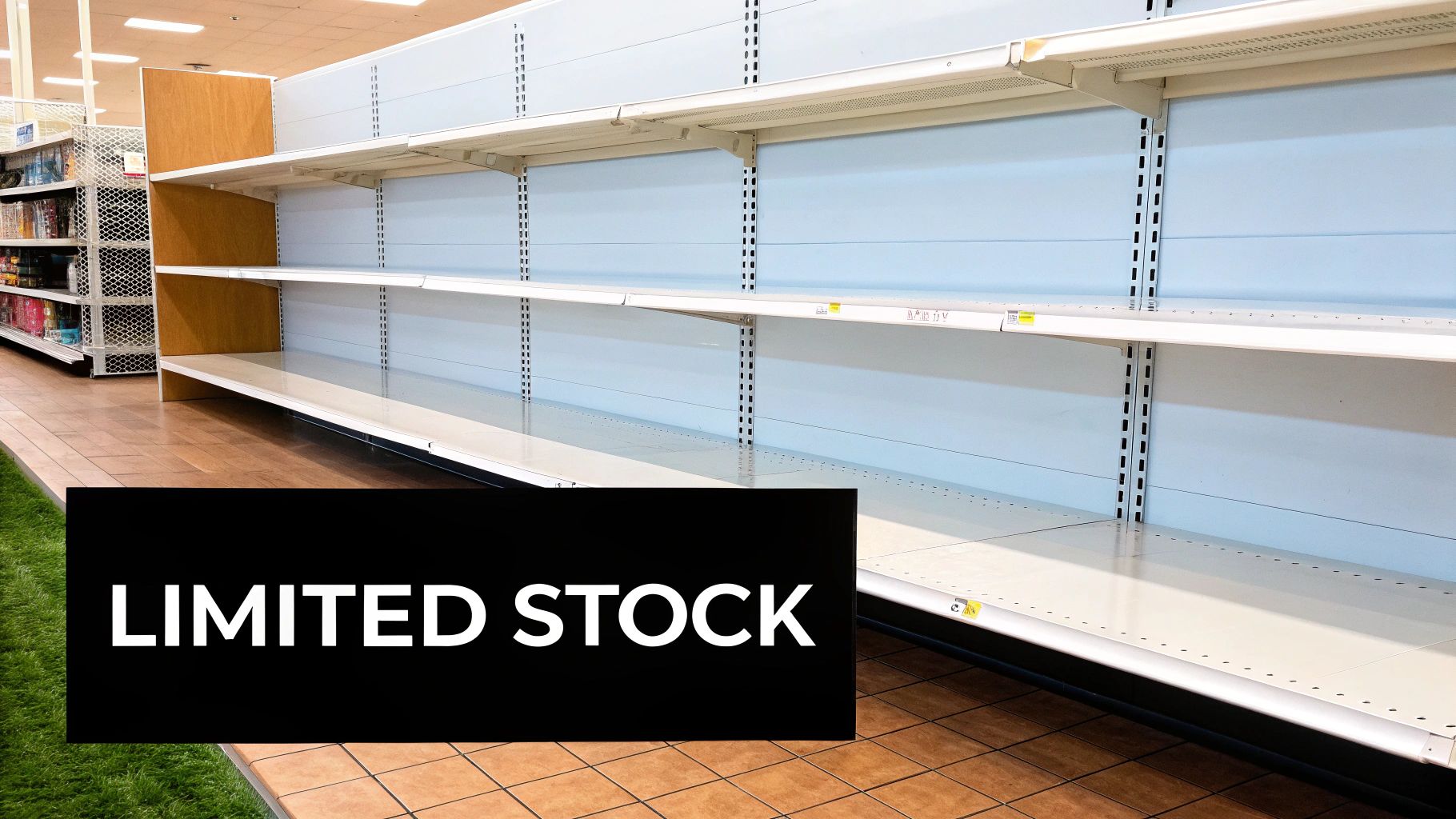 Supermarket aisle displaying mostly bare shelves with a prominent 'LIMITED STOCK' sign, indicating inventory shortages.