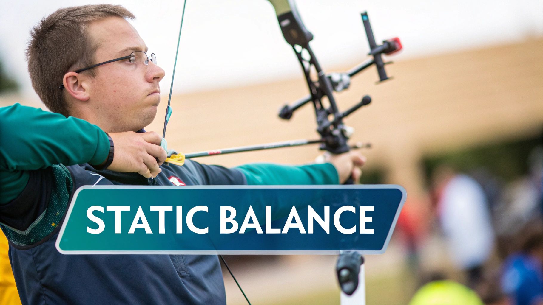 A male archer wearing glasses and a teal shirt, focused on aiming his bow and arrow.