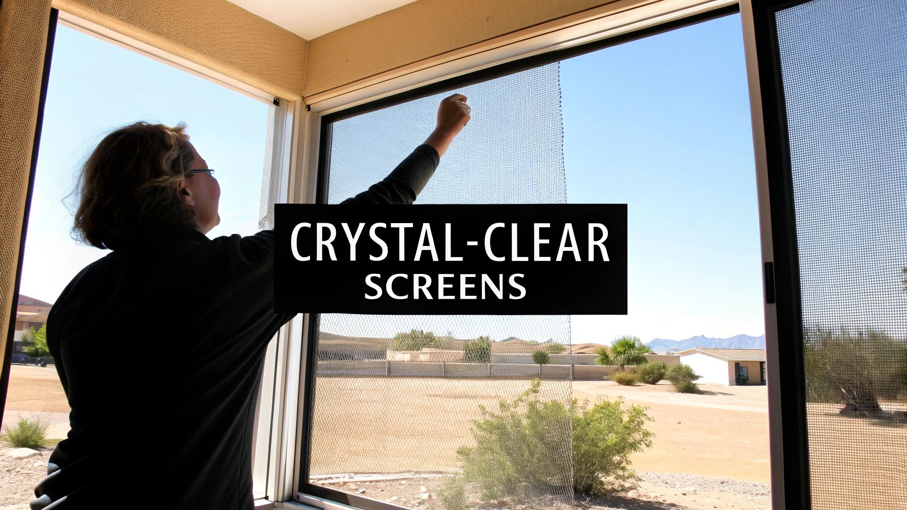 Woman installing a crystal-clear window screen, showcasing its transparency against a sunny outdoor view.