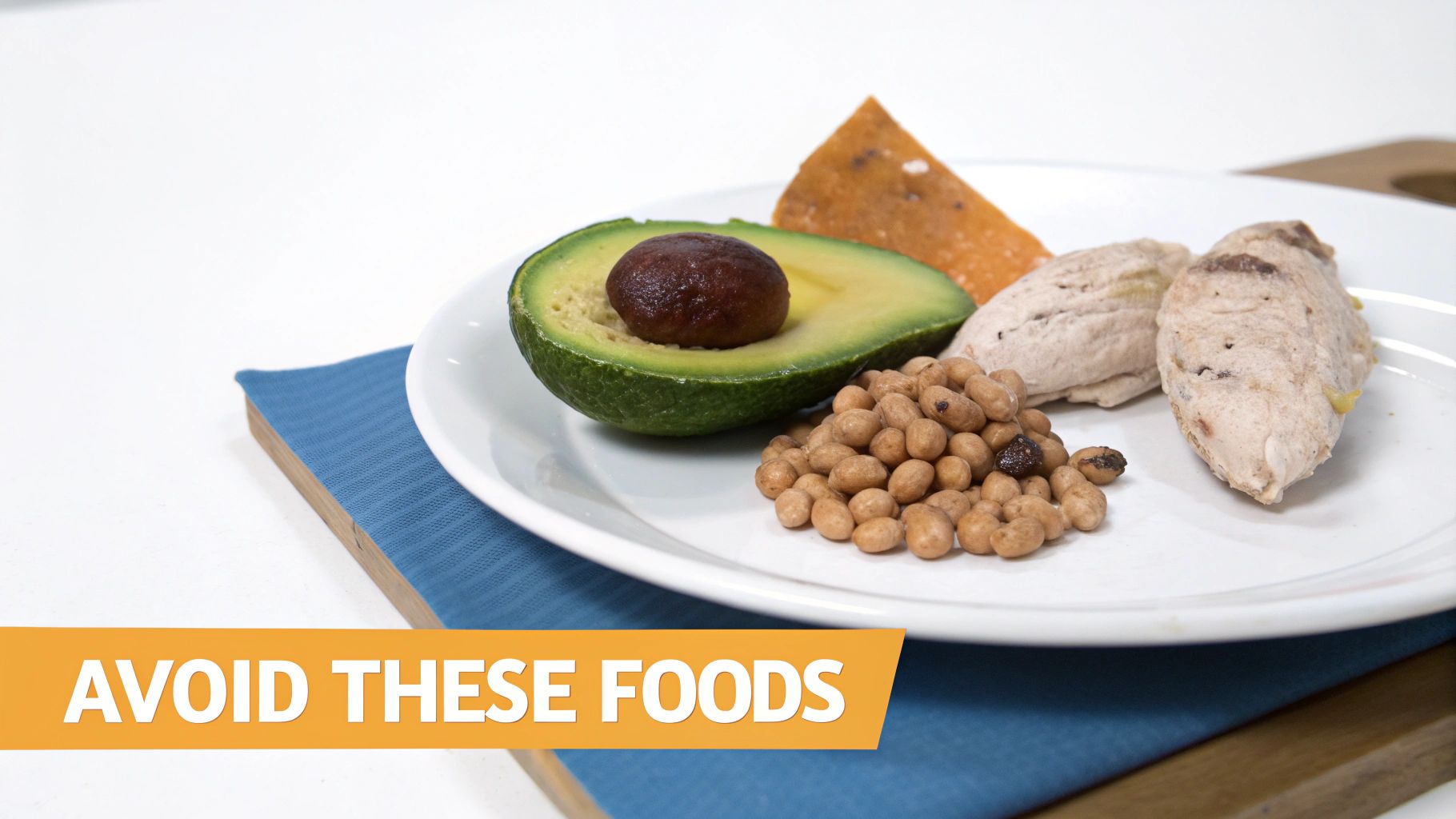 A white plate on a blue napkin showing avocado, beans, and other foods with text 'AVOID THESE FOODS'.