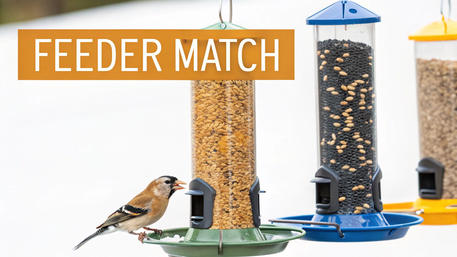 A bird feeder covered in snow with birds eating from it.