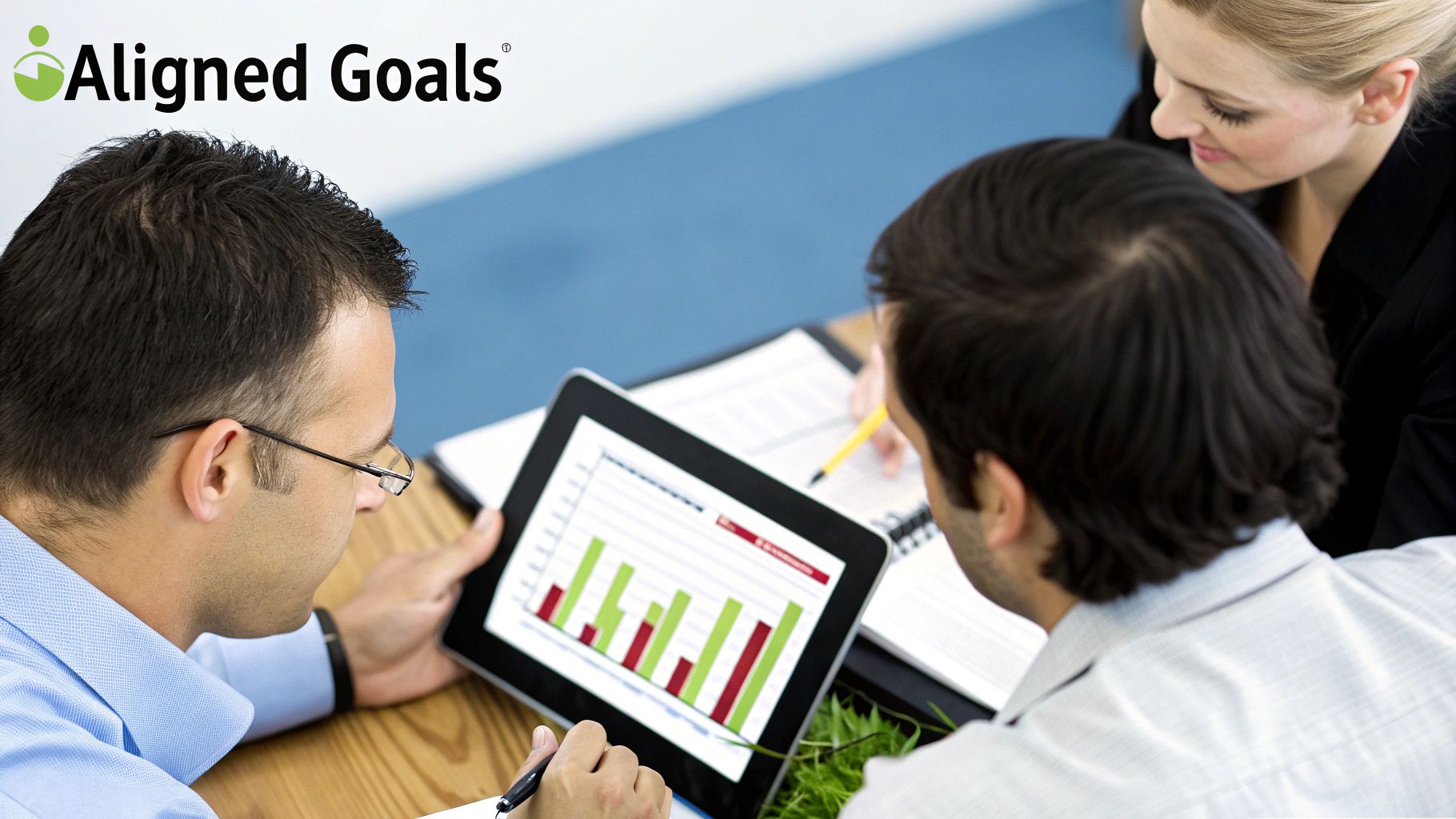 A group of professionals collaborating in an office, symbolizing a results-based partnership.