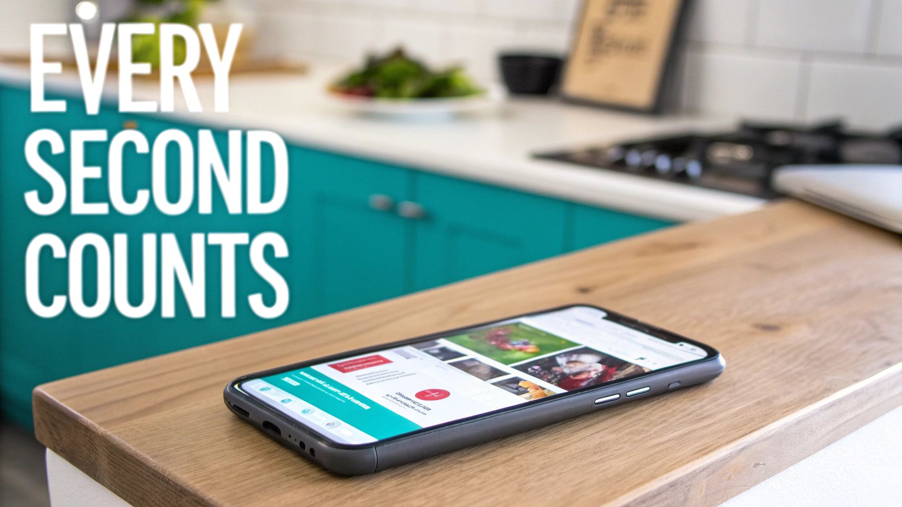 A smartphone displaying a website on a light wooden kitchen counter with teal cabinets in the background.