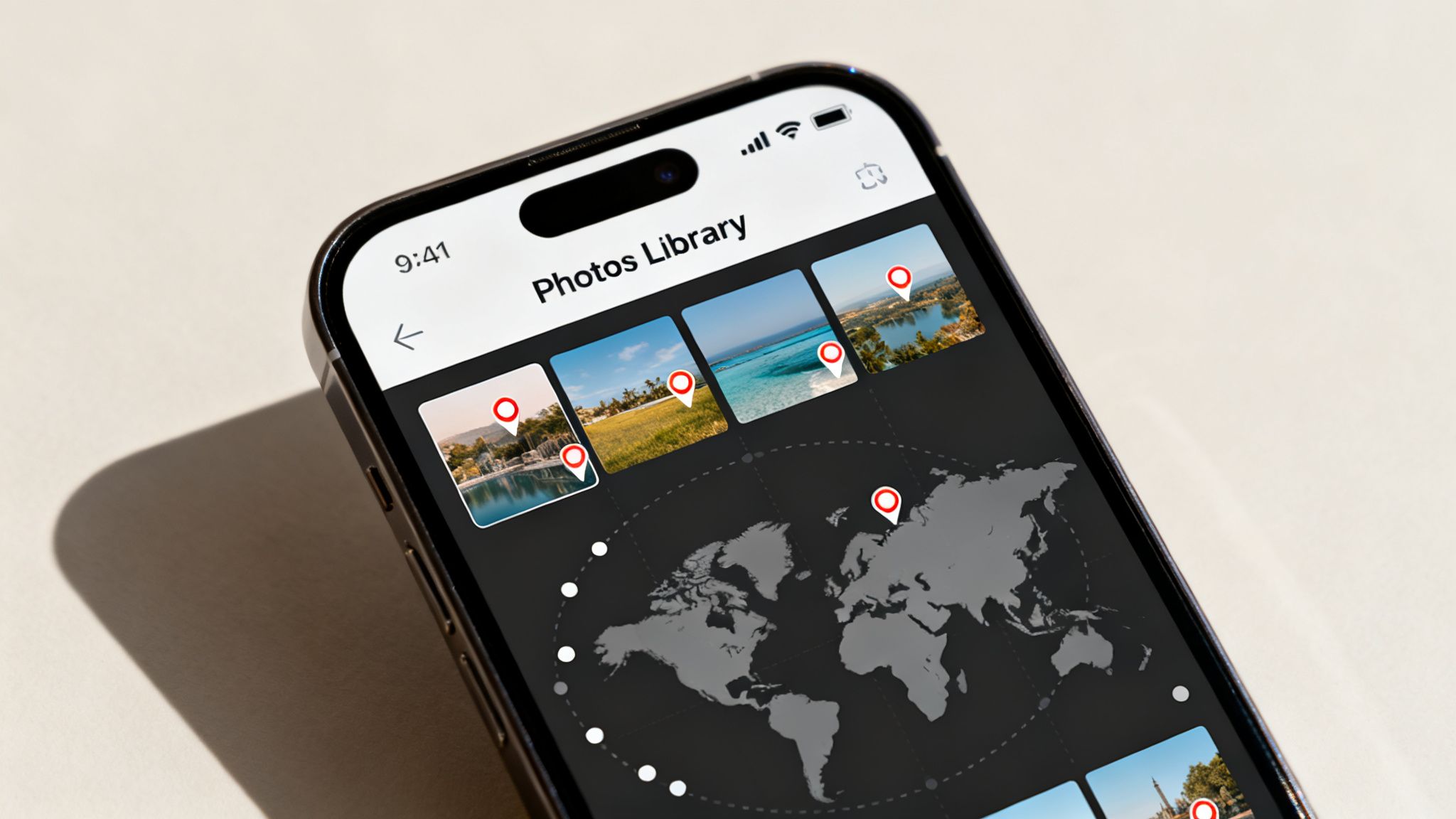 An iPhone displays a 'Photos Library' app with travel photos linked to a world map using location pins.