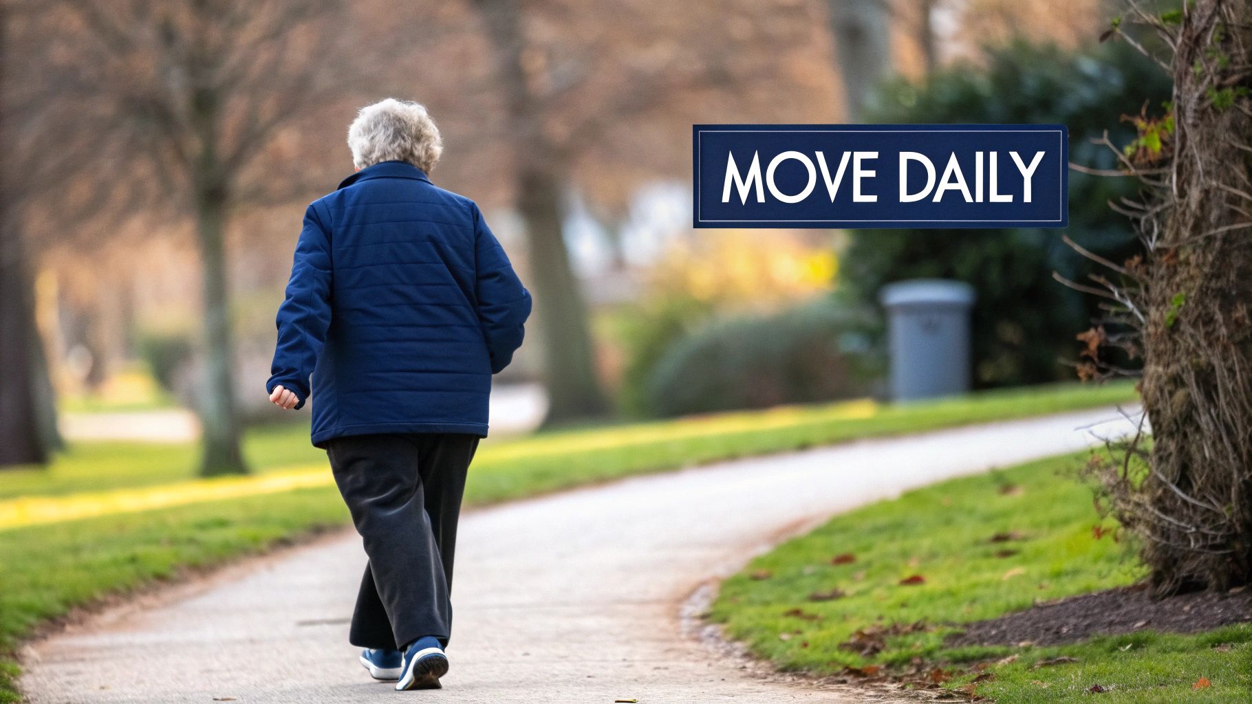 An older adult walks on a paved park path, with a blue sign reading 'MOVE DAILY' in the background.