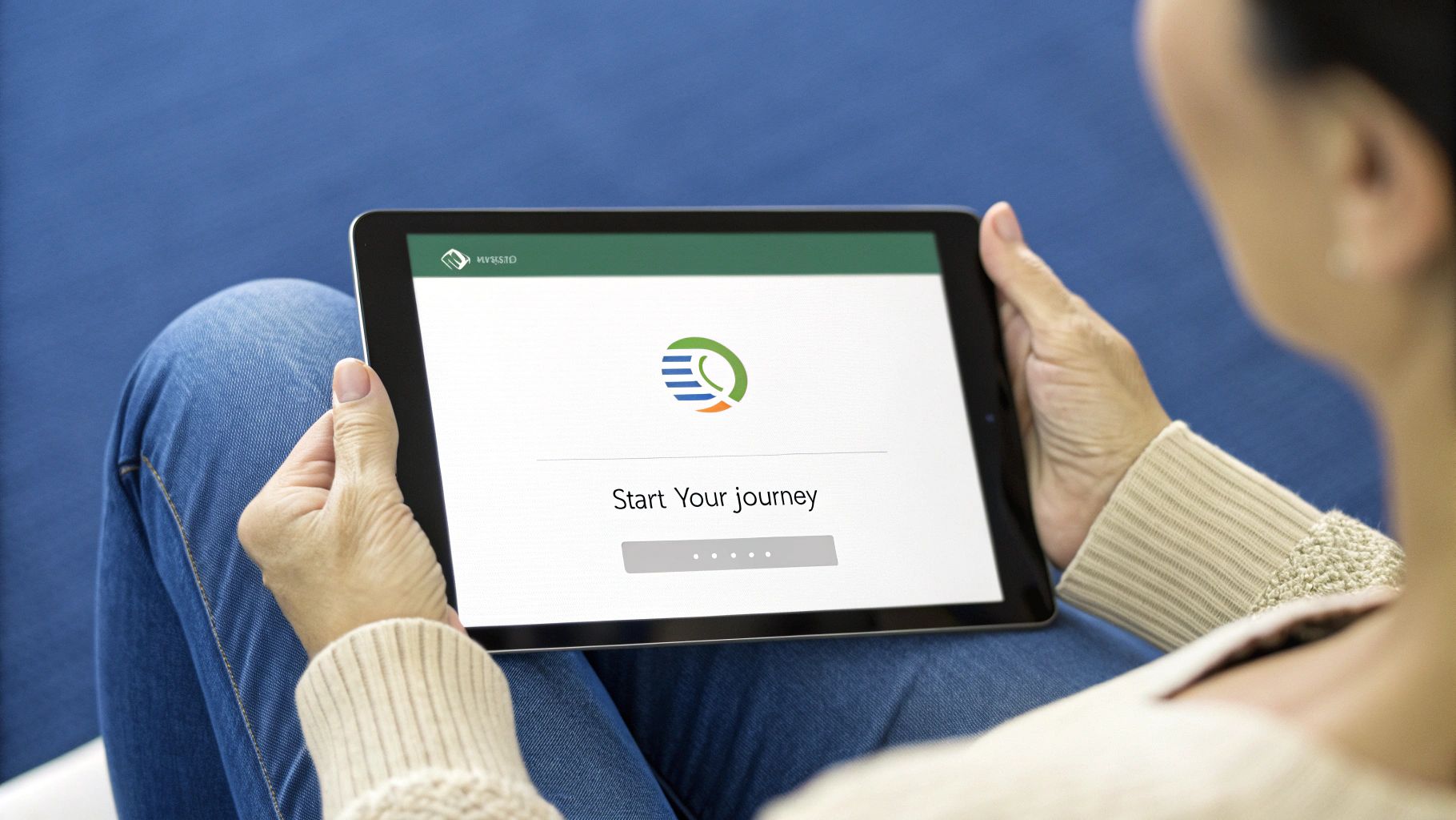 A smiling woman at her desk, ready to start an online consultation on her laptop.