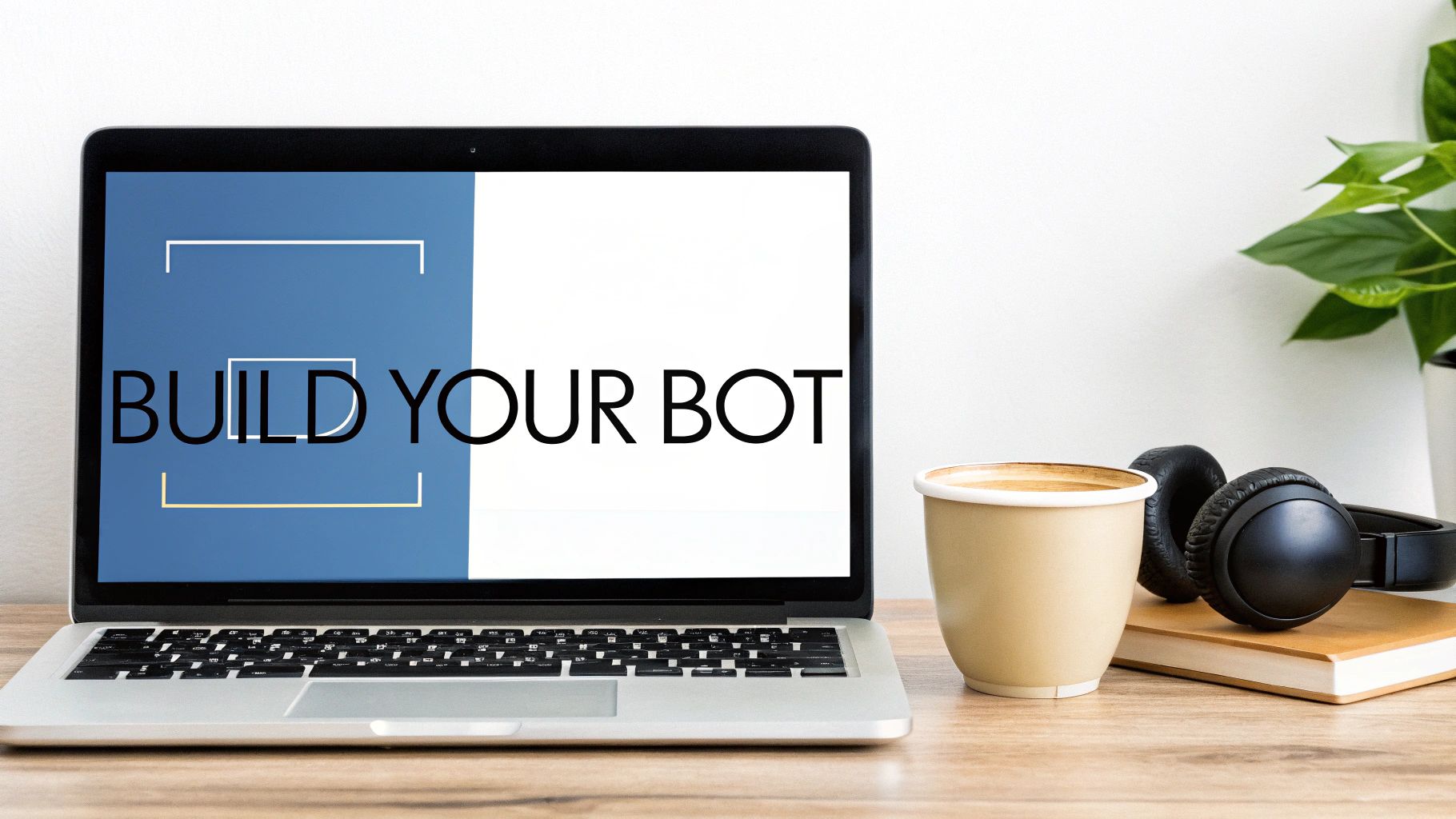 A laptop displaying 'BUILD YOUR BOT' on screen, with a coffee cup and headphones on a wooden desk.