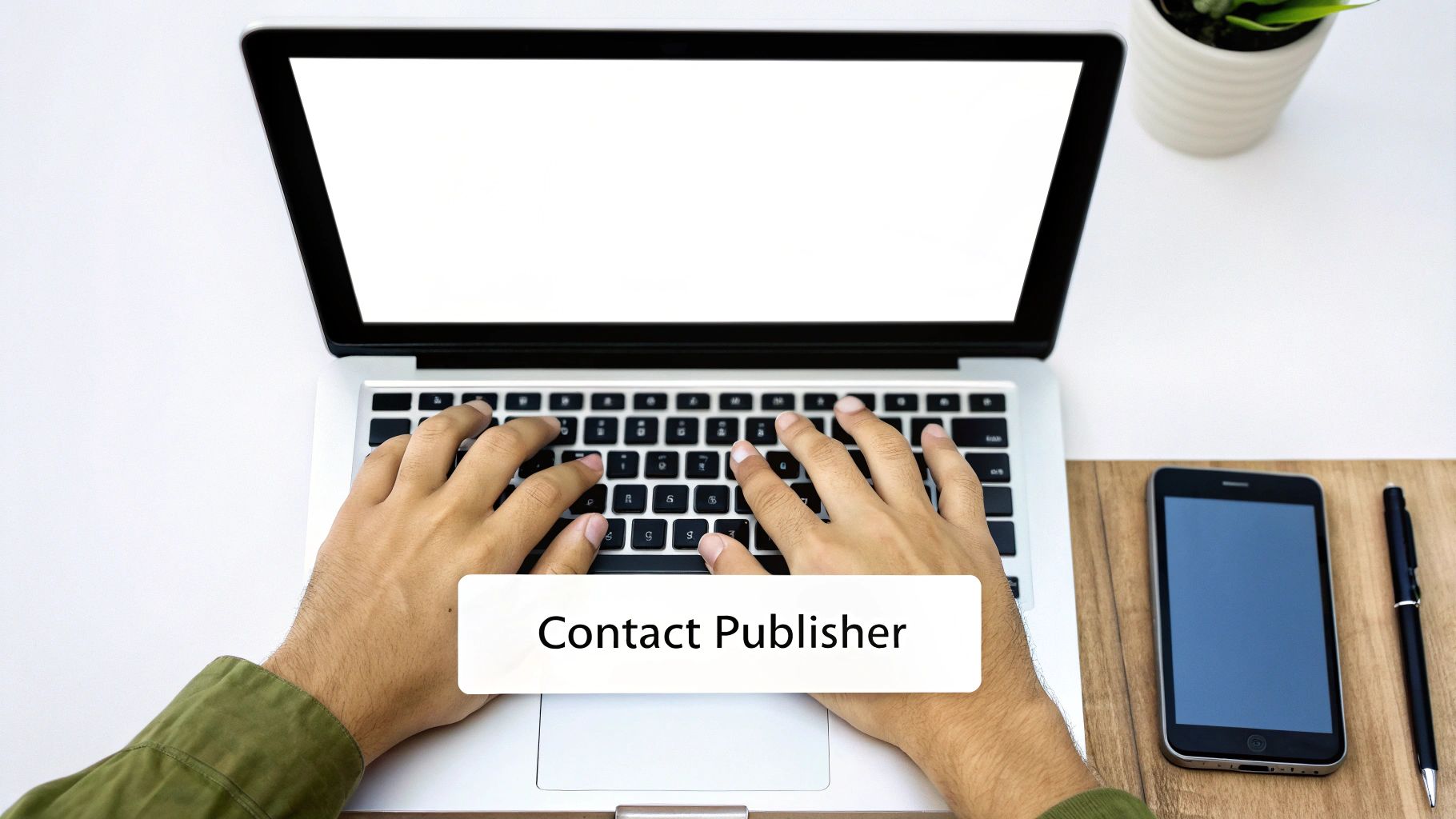 Person writing an email on a laptop, representing publisher outreach