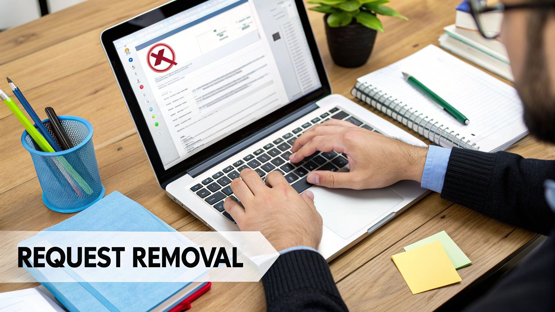 Man typing on a laptop, screen shows a red X and 'Request Removal' text.