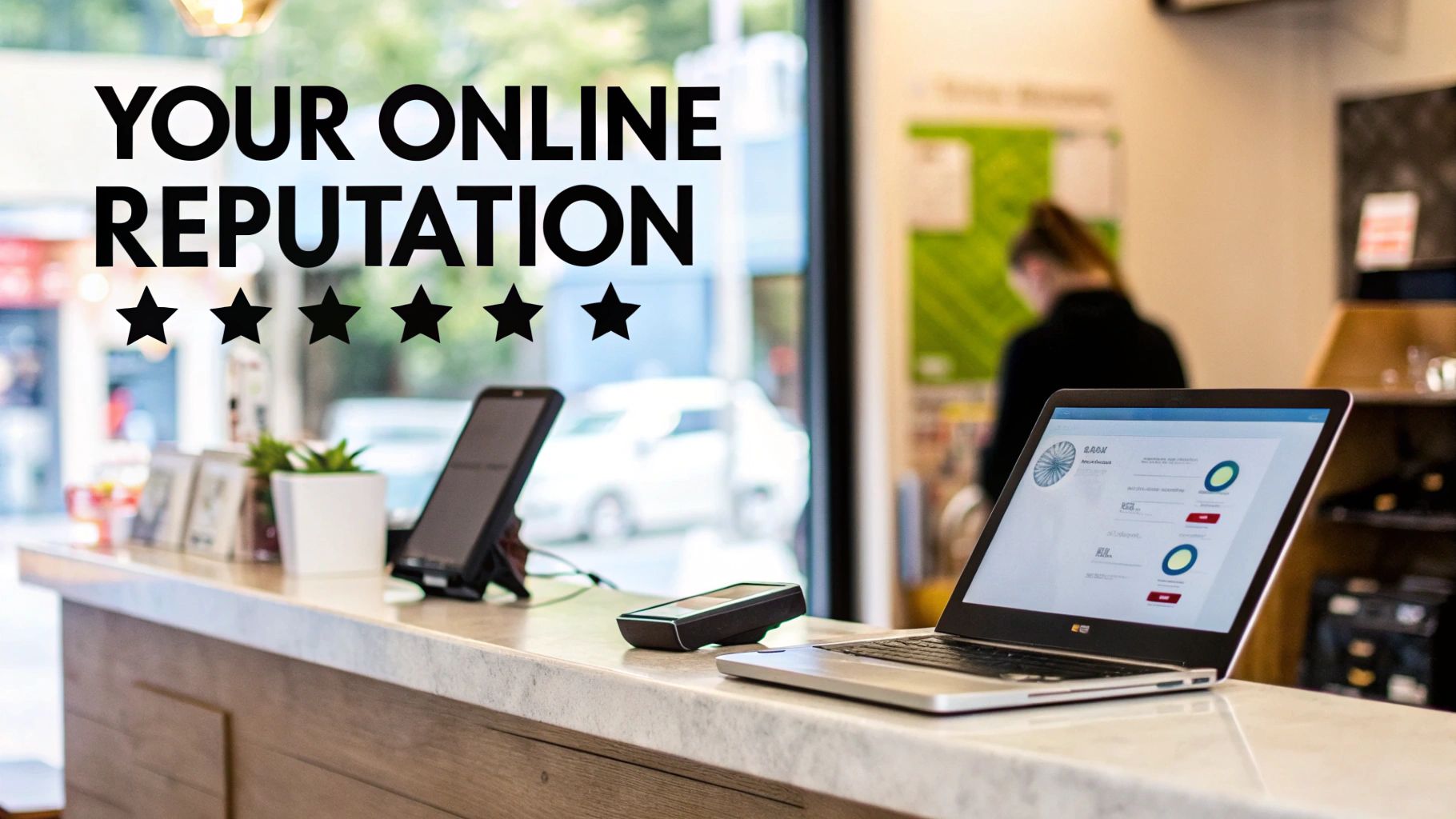 A person working on a laptop with a coffee, managing online reputation tasks.