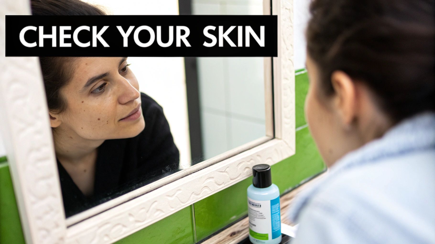 A woman looks closely at her reflection in a mirror, carefully checking her skin.