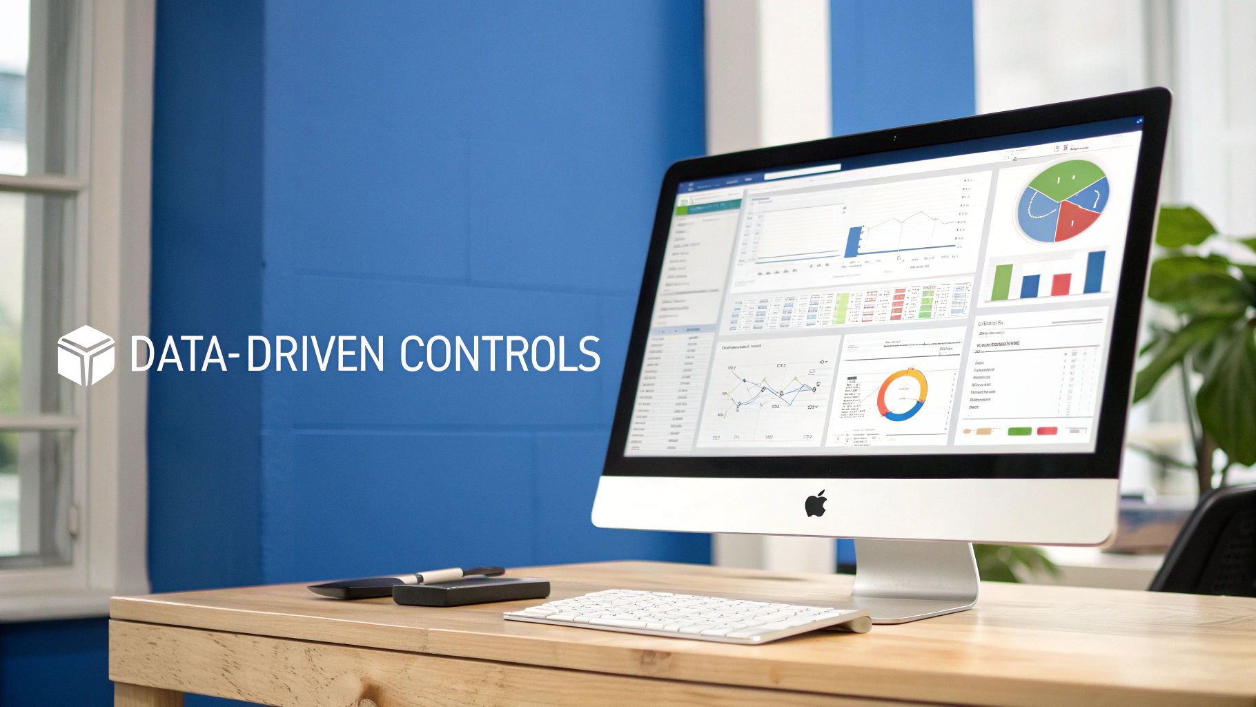 Desktop computer displaying data analytics dashboard with charts, graphs, and financial performance metrics
