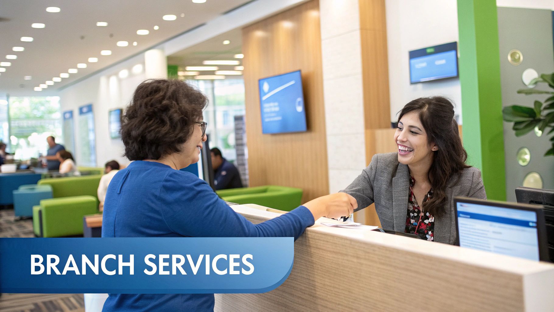 A modern, brightly lit office space with engineers collaborating around computer screens, representing the tech-focused environment at Austin Capital Bank.