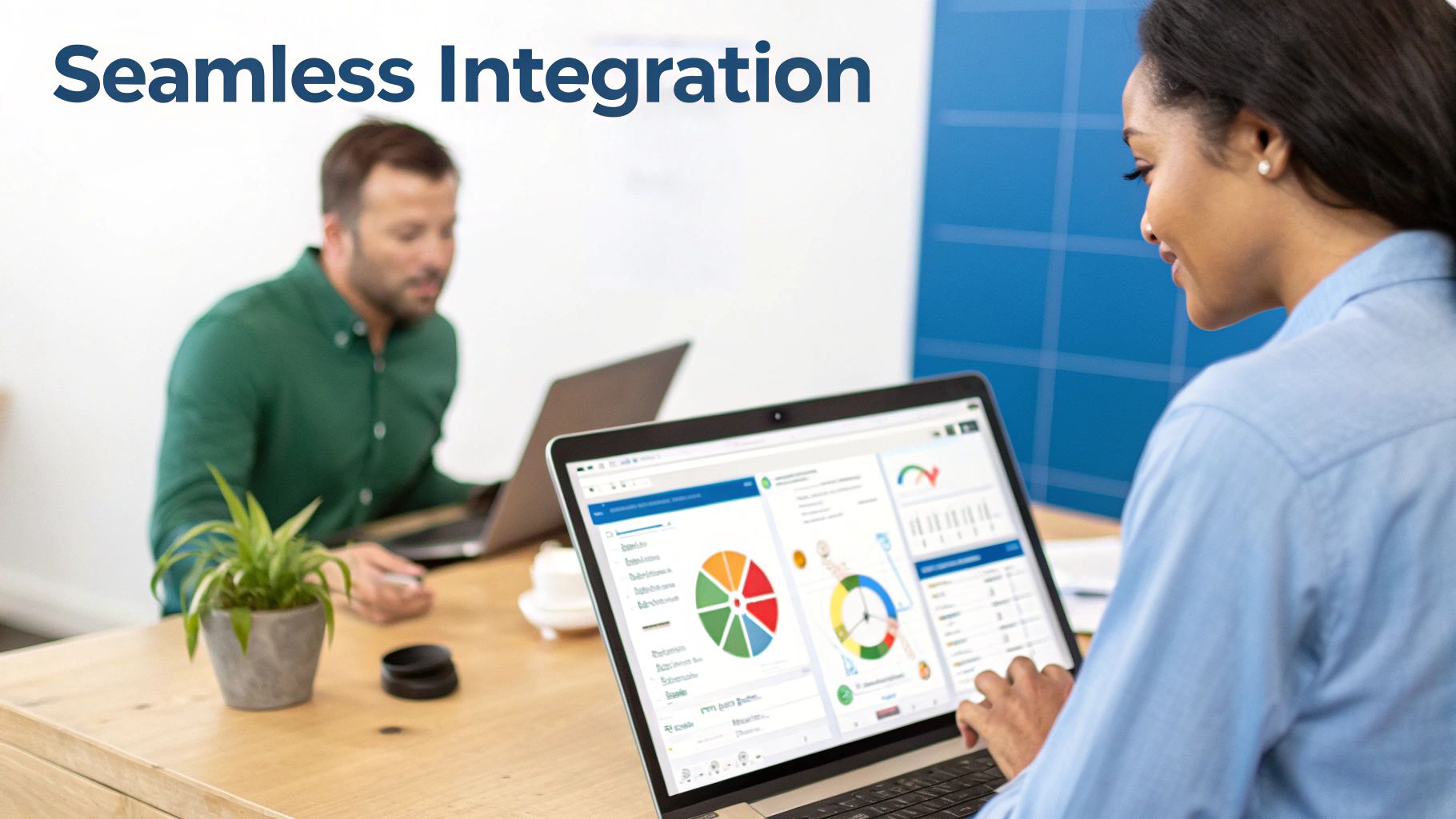 A woman reviews data visualizations on her laptop in an office, showcasing seamless integration.