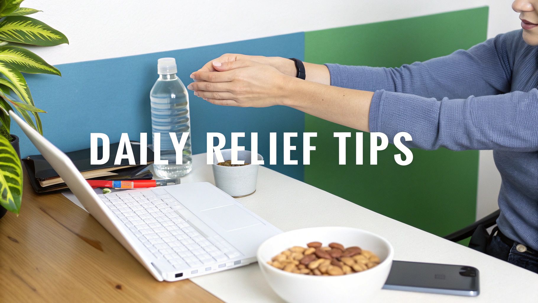 Hands stretching above a desk with a laptop, plant, and snacks for daily relief.