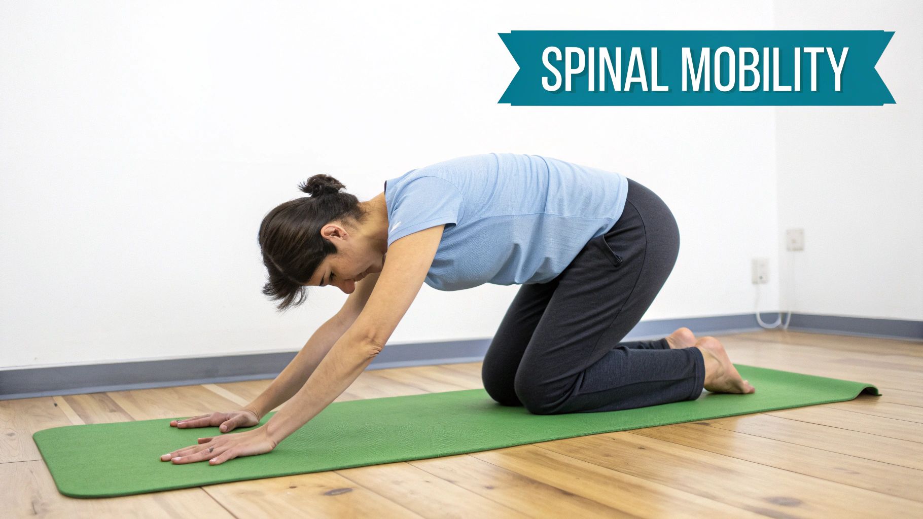 Woman on a green yoga mat demonstrating a spinal mobility exercise, possibly child's pose.
