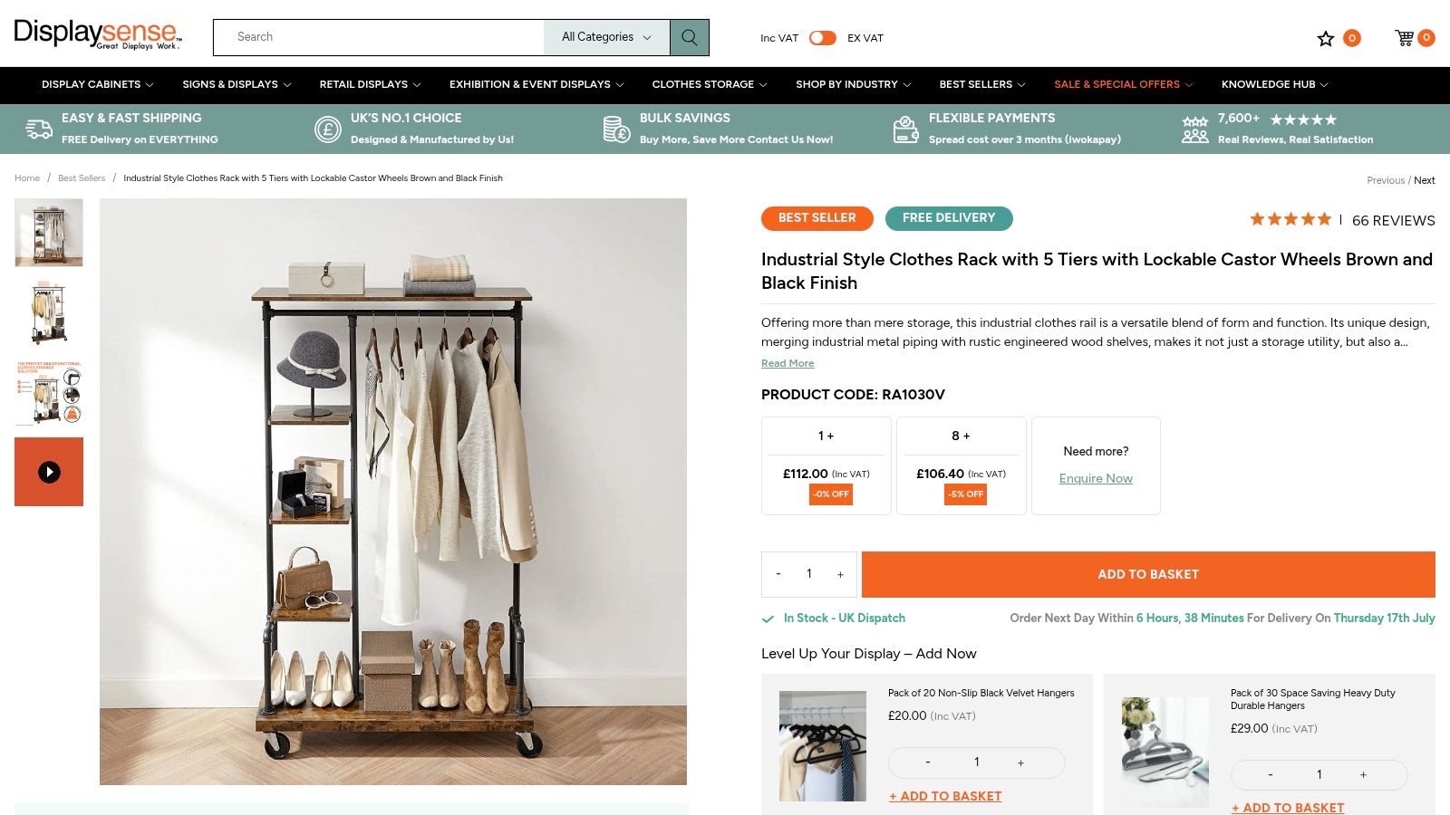 Displaysense industrial-style clothes rail with wooden shelves and black metal piping on castor wheels.