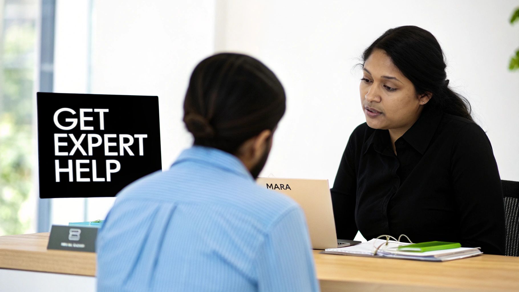A professional migration agent assisting a client with their Australian visa application.