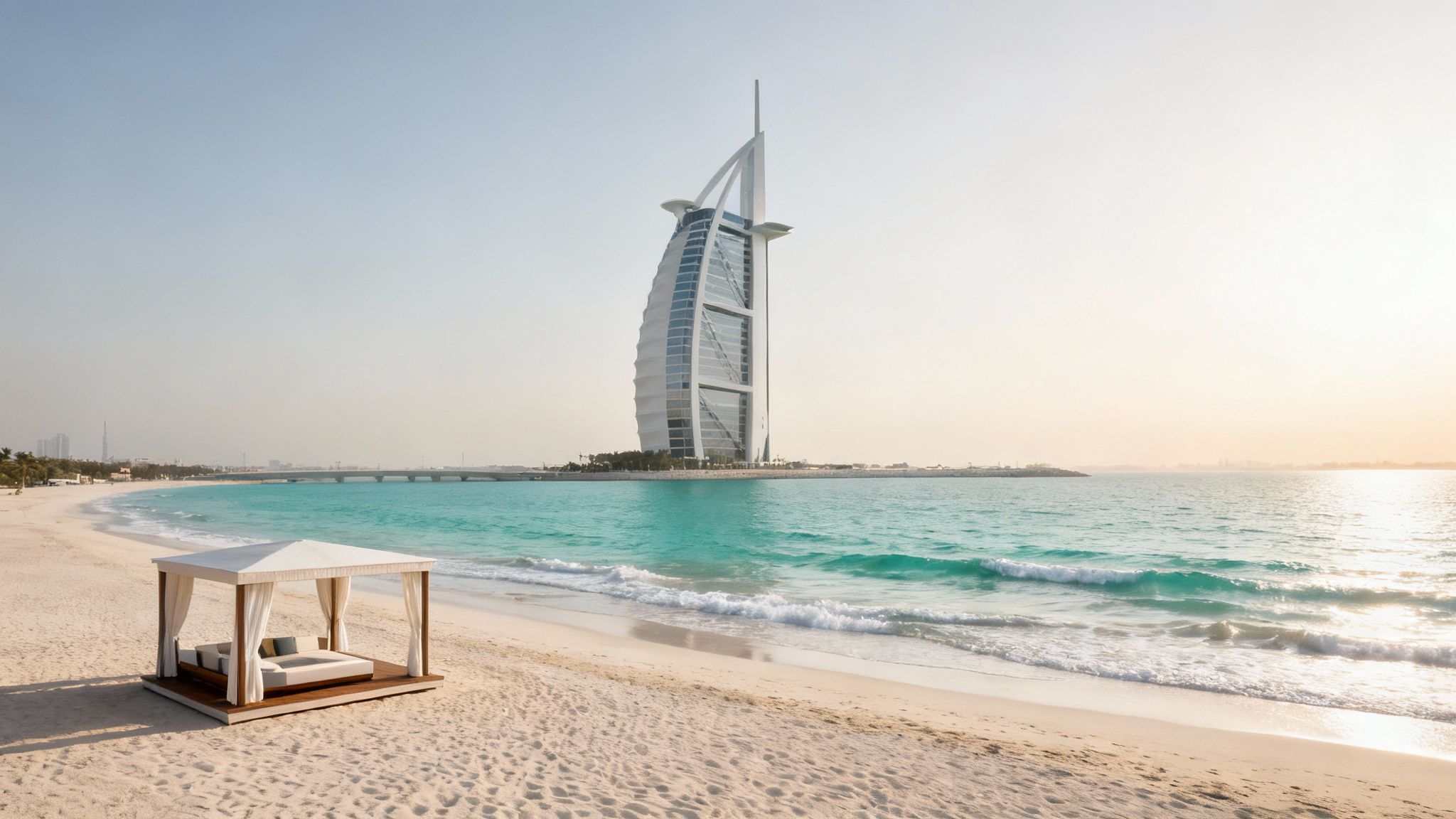 Luxurious beach in Dubai with the iconic Burj Al Arab hotel and a white cabana.
