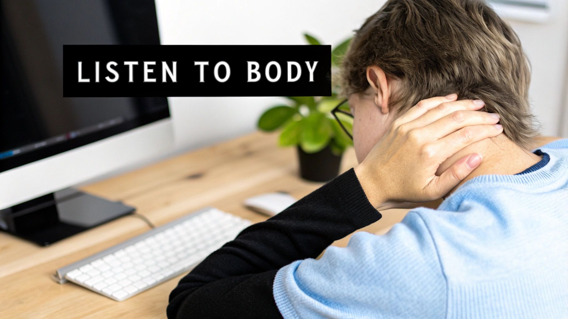 Person rubbing their neck from behind, sitting at a computer desk with 'LISTEN TO BODY' text overlay.