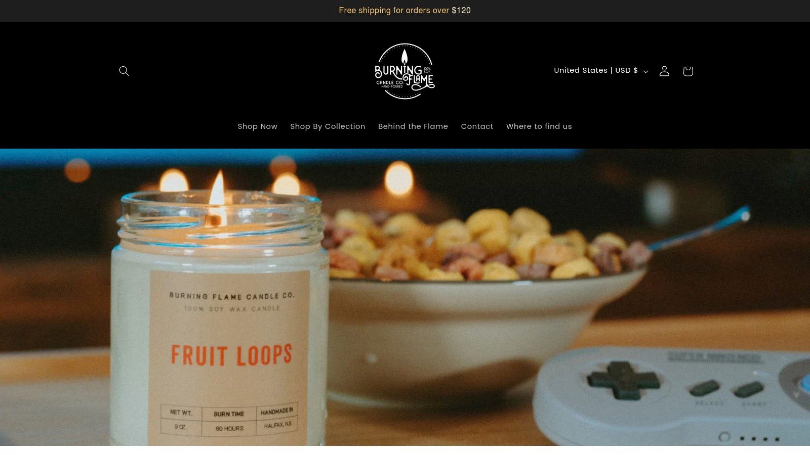 A display of Burning Flame Candle Company's soy wax candles in minimalist jars with clean labels.