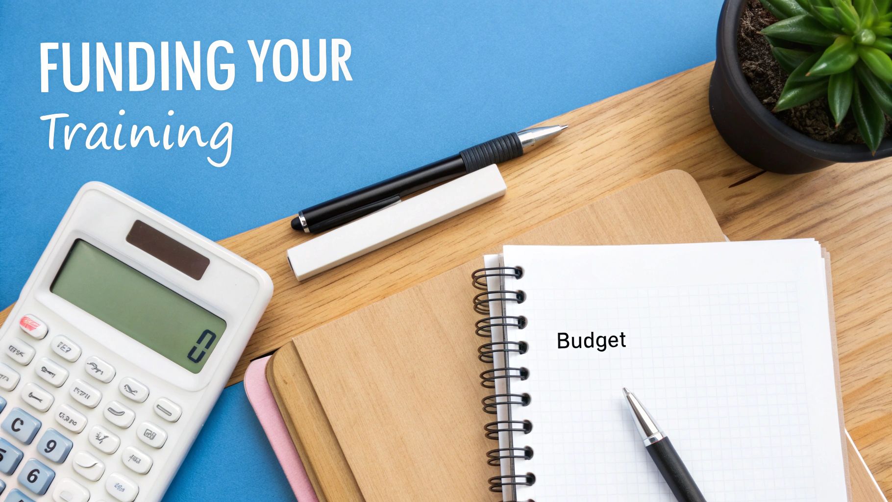Budget planning notebook with calculator and pen for funding training courses and education